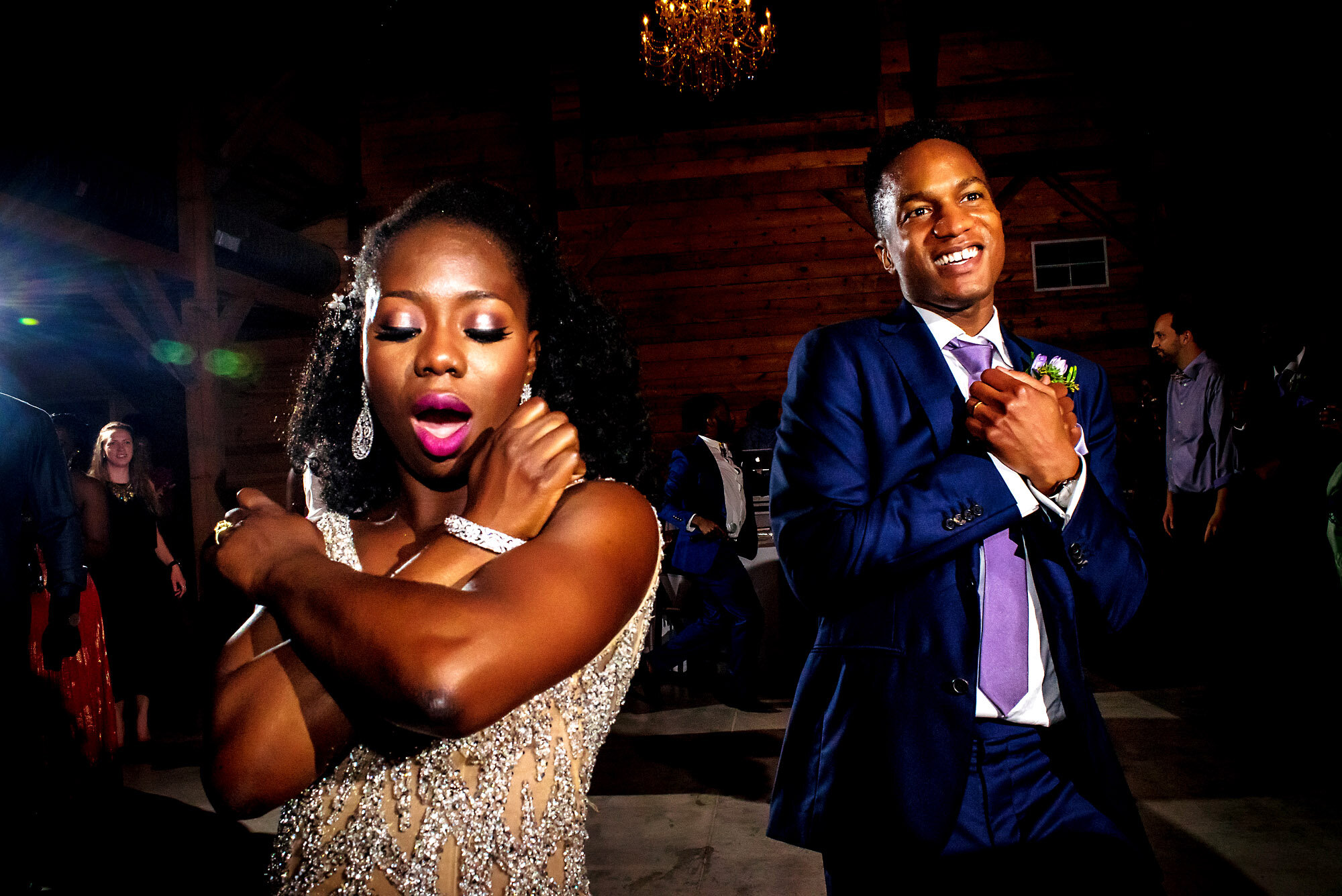 71-Austin-wedding-photographer-Jide-Alakija-bride and groom doing the wakanda sign on the dance floor.jpg.JPG