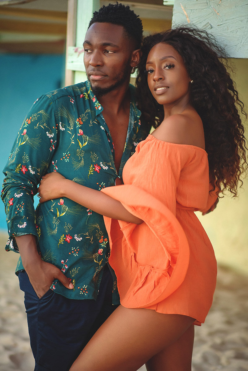 11-Aruba-wedding-photographer-Jide-Alakija-Boy looks away as girl holds him and looks in camera- engagment shoot.jpg.JPG