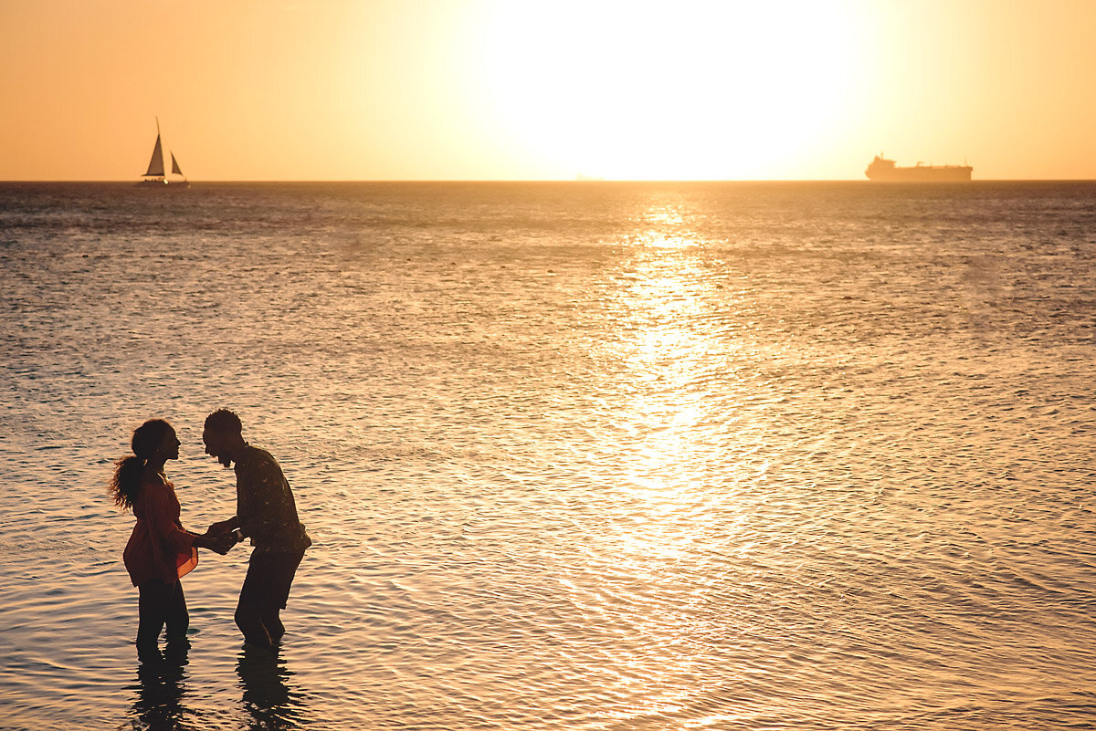 13-Aruba-wedding-photographer-Jide-Alakija-Silhouette of couple in water in aruba- engagment shoot.jpg.JPG