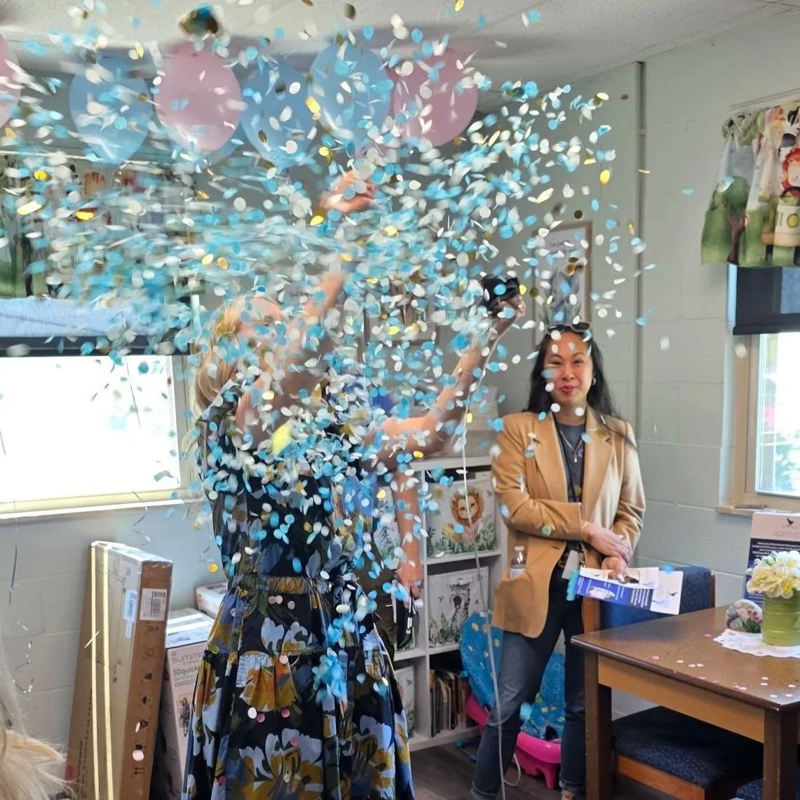 popping reveal balloons to officially open Walking with Moms in Need