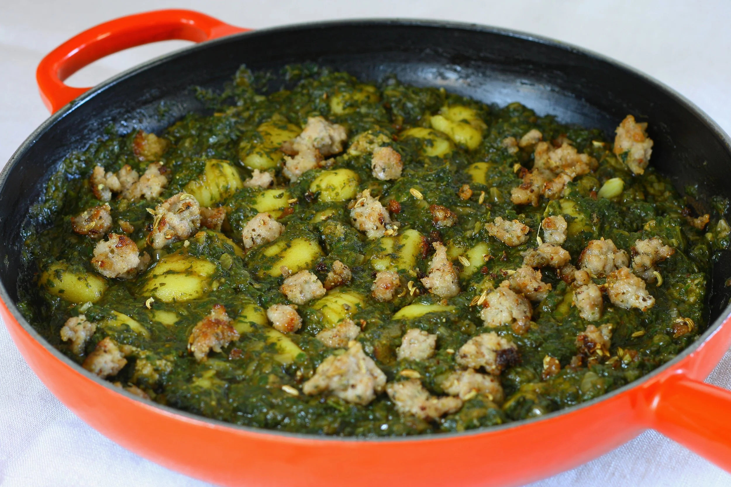 Gnocchi in a bkeila-style spinach sauce with sausage
