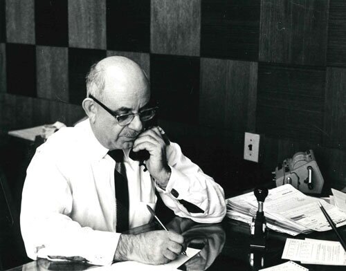 Harry Levi, Founding Partner of Artus Corp. working in the same office we still use today. (photo circa 1960)
