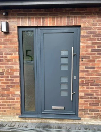 Anthracite Grey Aluminium Door with bar handle and etched door number in side panel