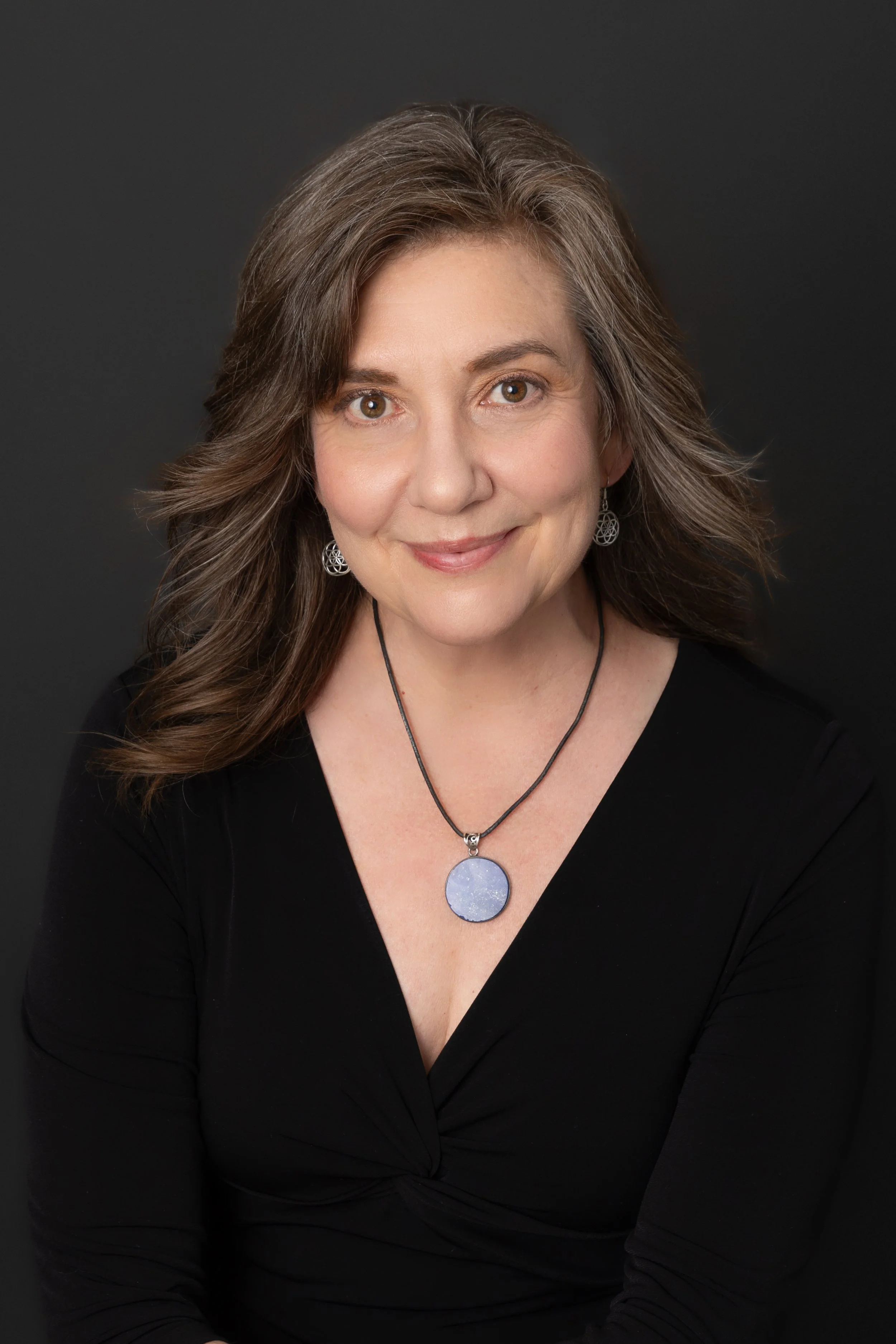 Laura Van Prooyen-Headshot-Closed Smile.jpg