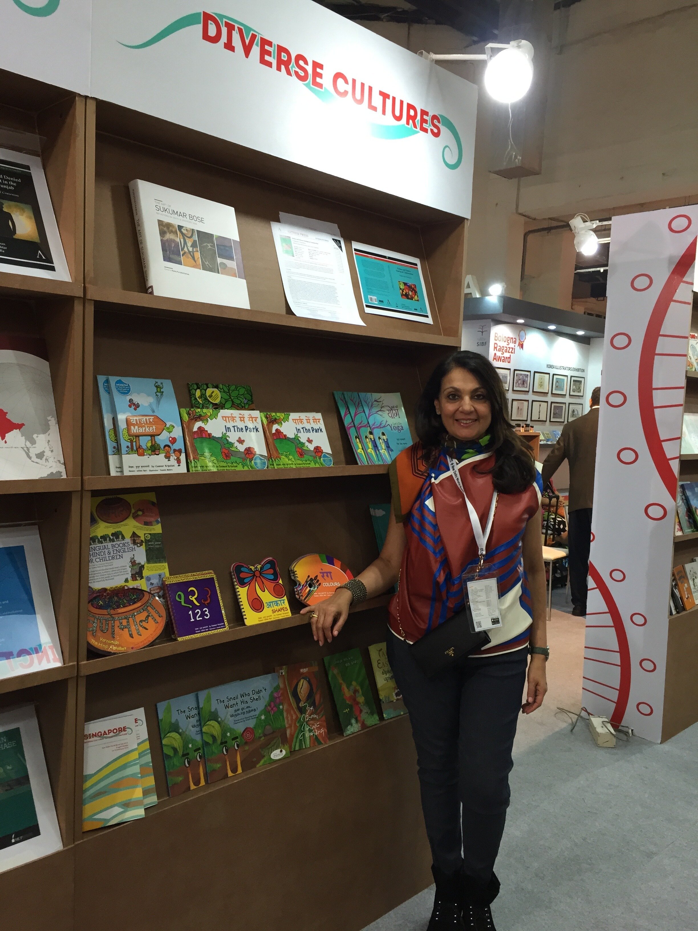 Coonoor Kripalani showing her bilingual English/Hindi children's books at the New Delhi World Book Fair in 2015