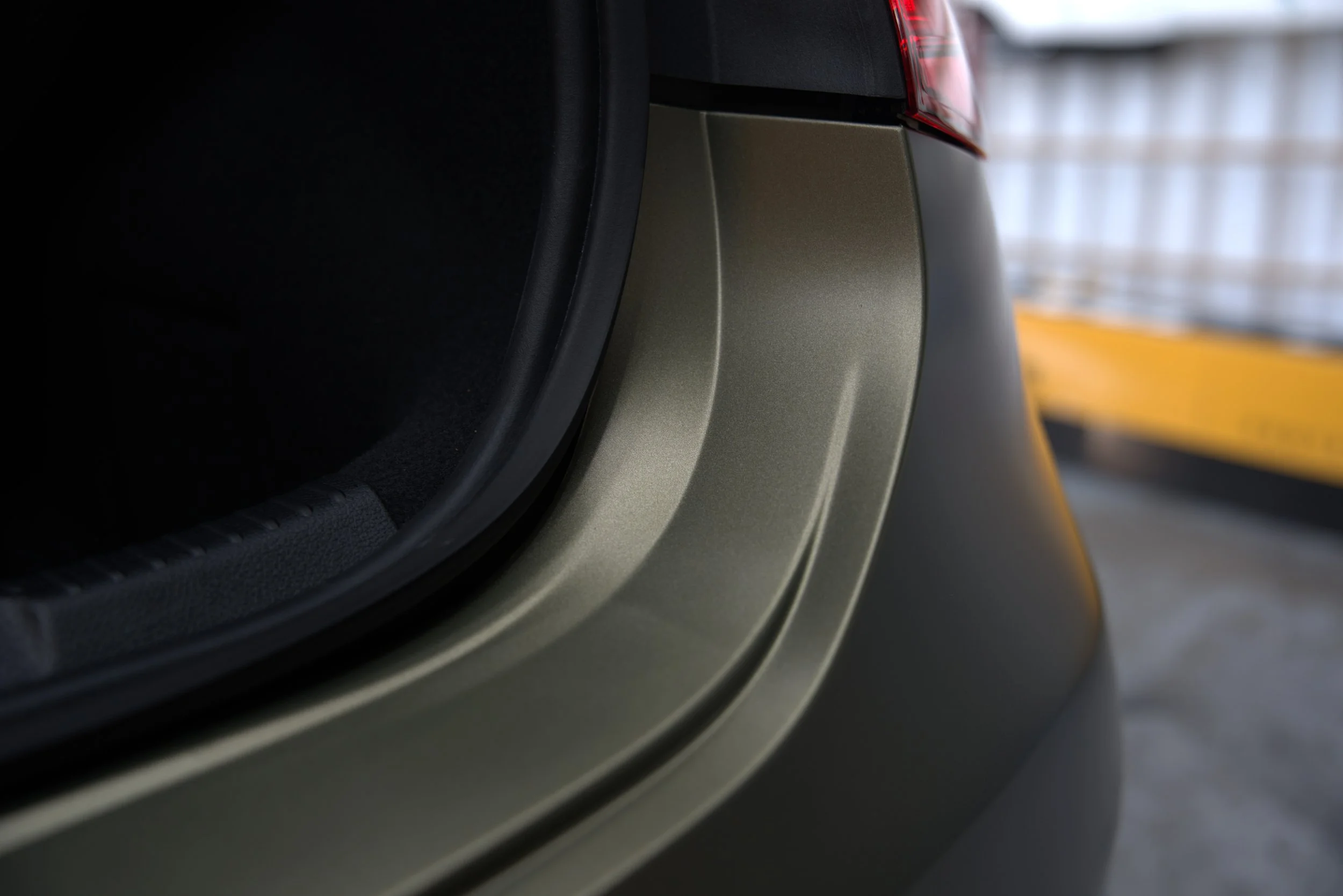 Close-up of the rear corner of a vehicle, vehicle wrap