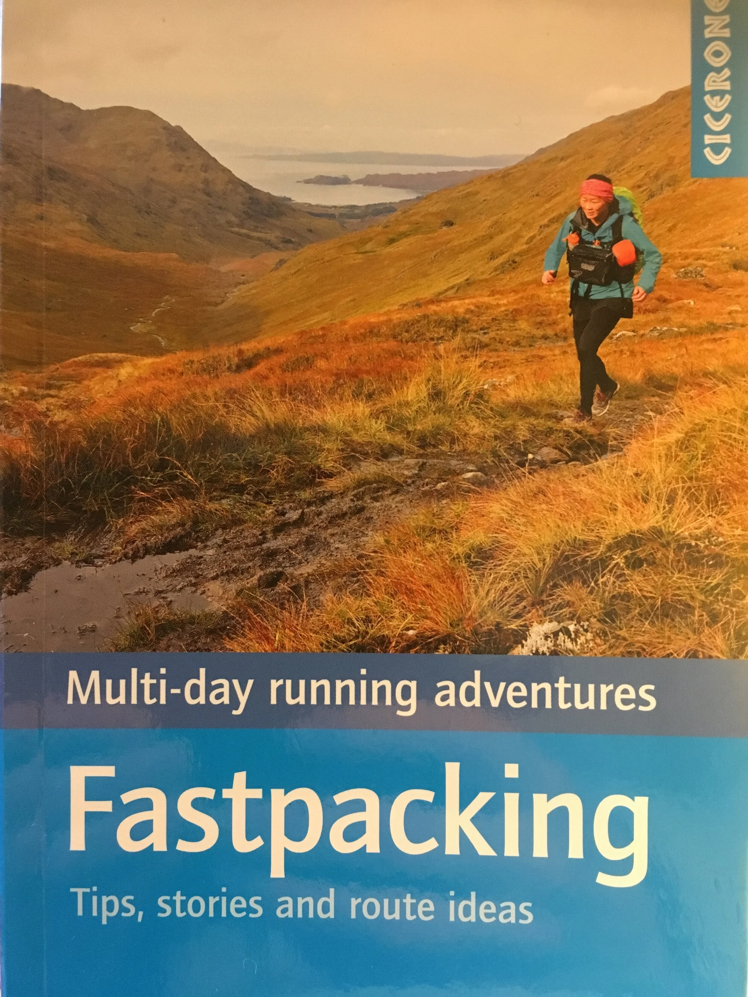 Book Cover of Fastpacking, tips stories and route ideas. Image of women running across mountain terrain.