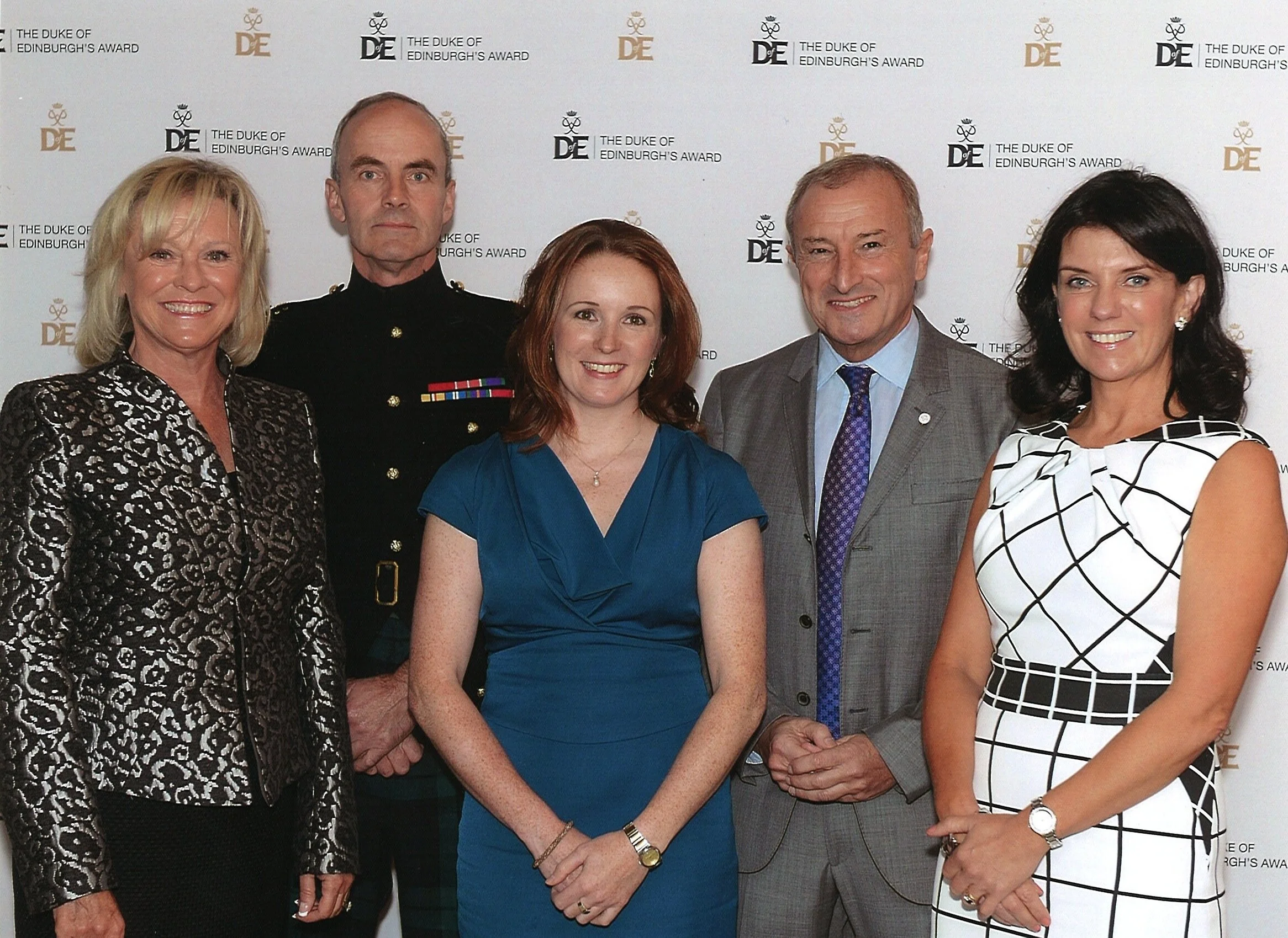 Tori James stands with a group of other attendees at St James Palace.
