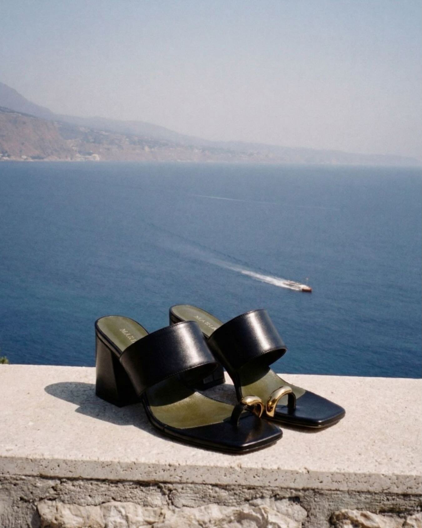 Minimal shape, bold presence.
The Black Olimpia Mule completes every look with ease.

Link in bio.