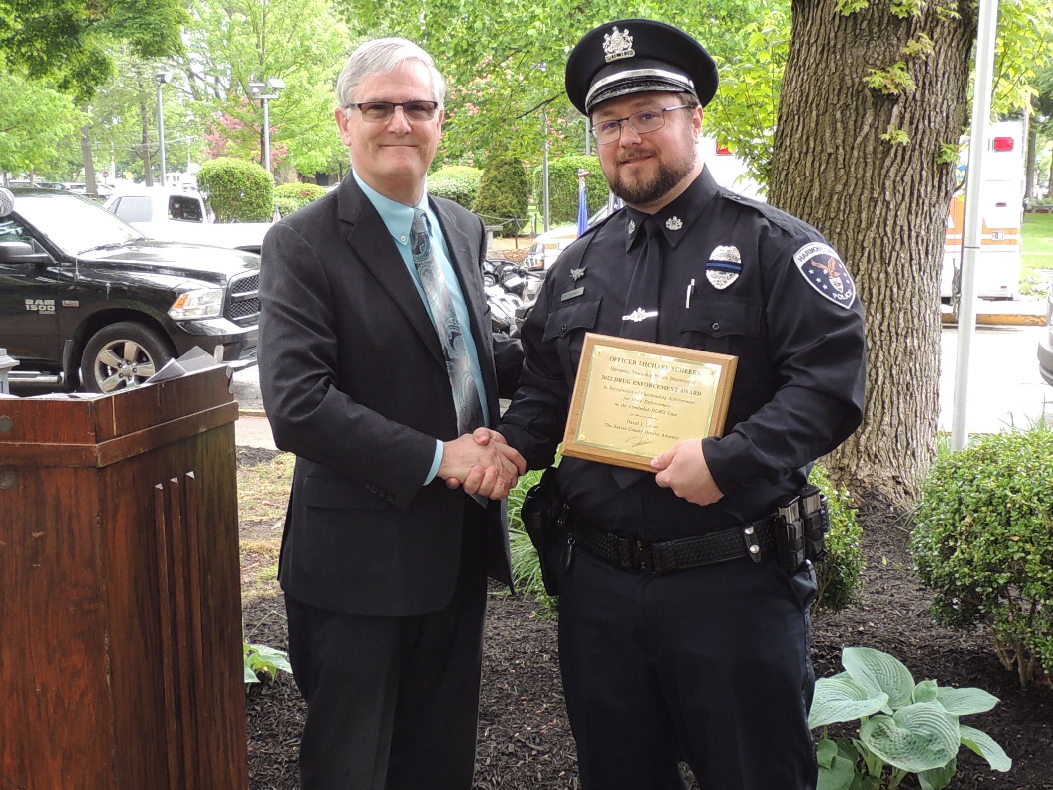 District Attorney David Lozier presents the Drug Enforcement Award to Officer Michael Scheers, Harmony Township Police Department.