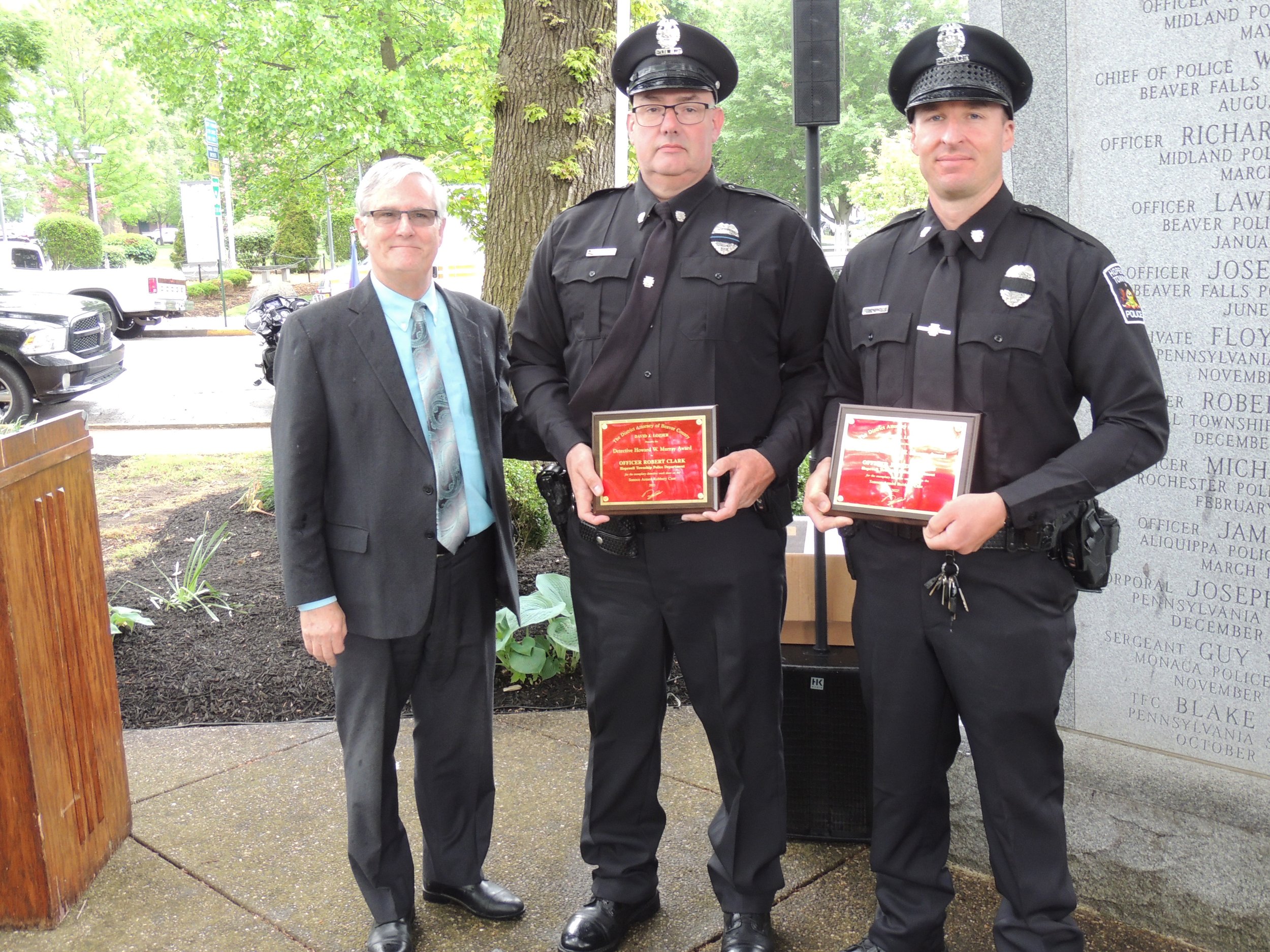 District Attorney David Lozier presents the Detective Howard Murray Award to Officer Robert Clark and Officer Jared Rogers, both from Hopewell Township Police Department.