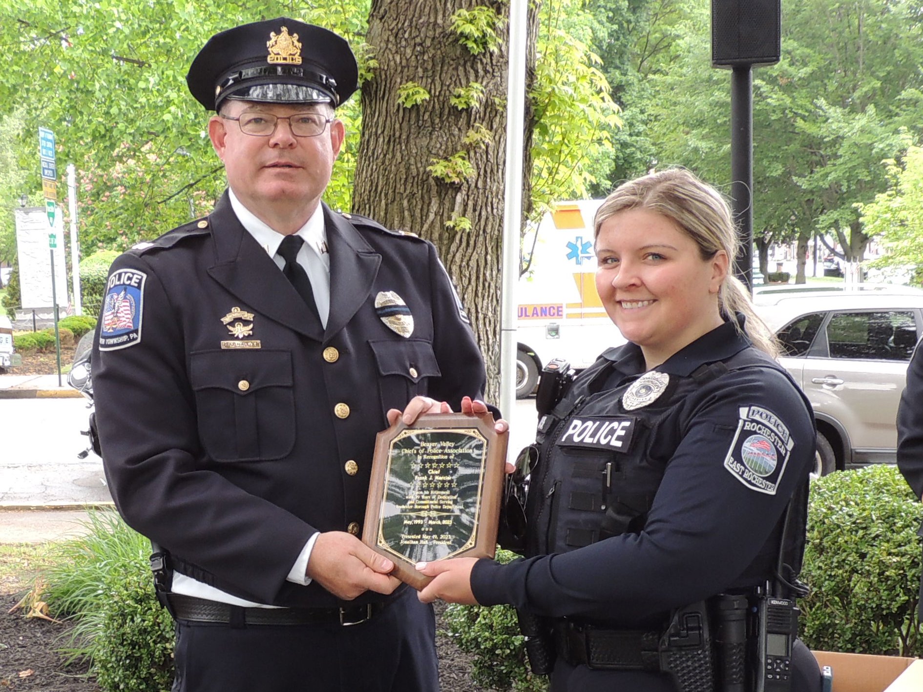 Captain Jonathan Hall presents a retiree plaque for Chief Frank Mercier (not pictured) to a Rochester Borough officer for his 30 years of service to Rochester Borough Police Department. 