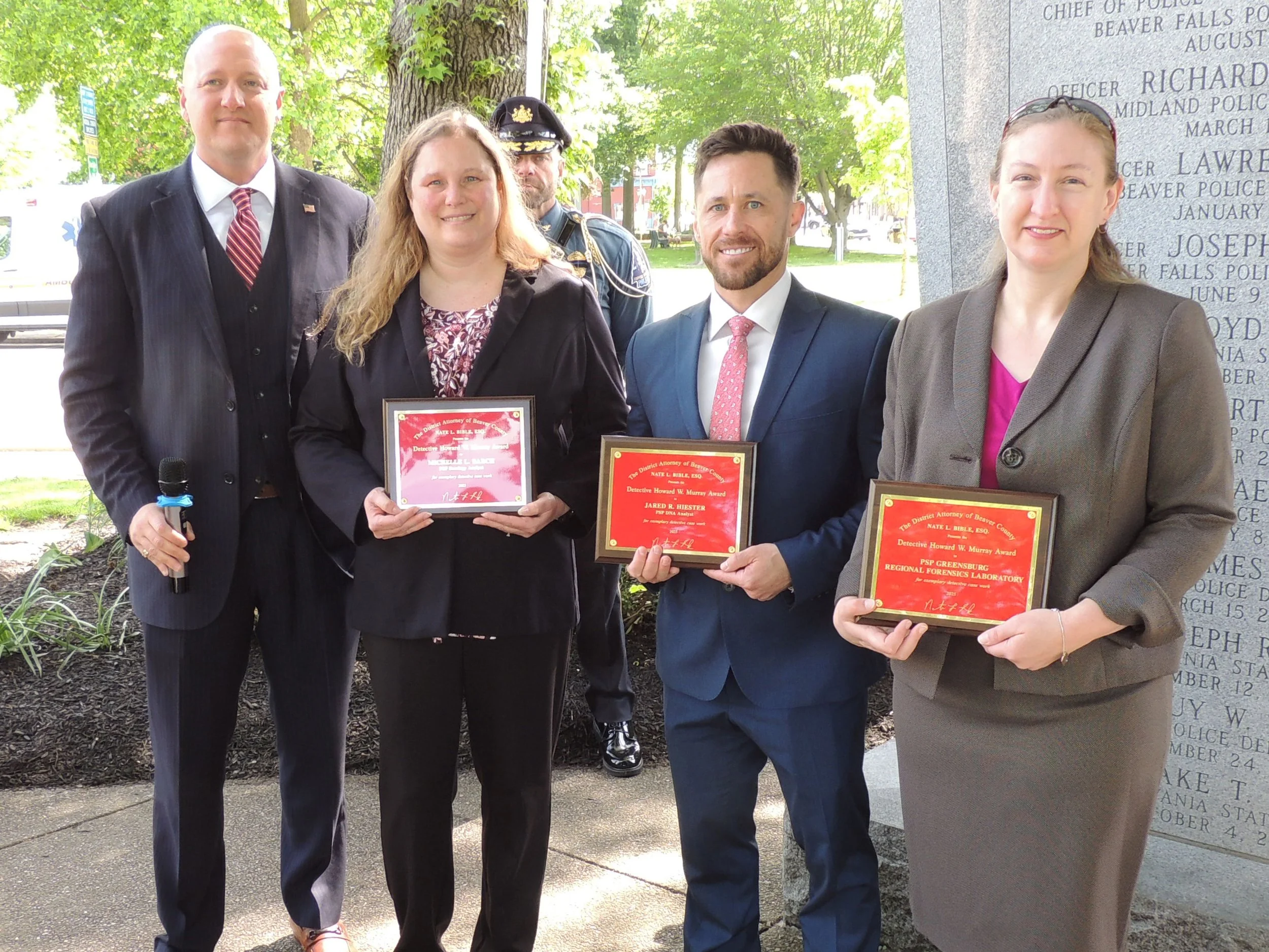  Nathan Bible (Beaver County District Attorney) presented PSP Greensburg Regional Forensics Laboratory, Michelle L. Barch (PSP Serology Analyst), and Jared R. Hiester (PSP DNA Analyst) with the Detective Howard Murray Award. 
