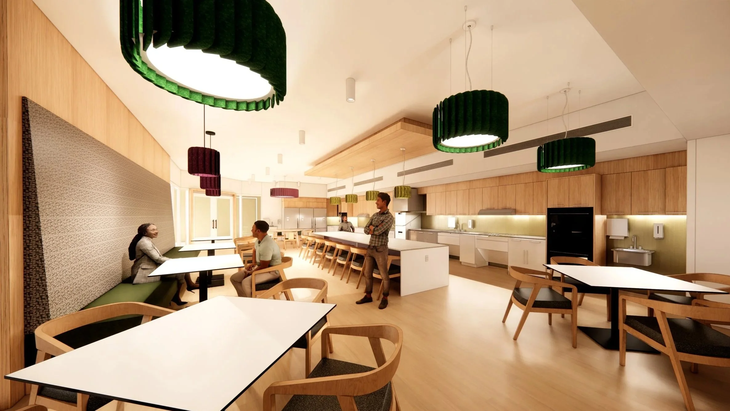 A graphic rendering of the future kitchen of 1680 Notre Dam Avenue. A large kitchen with oak cabinets and wheelchair level countertops. People sit at tables at the edge. Large colourful lights hand from the cieling.