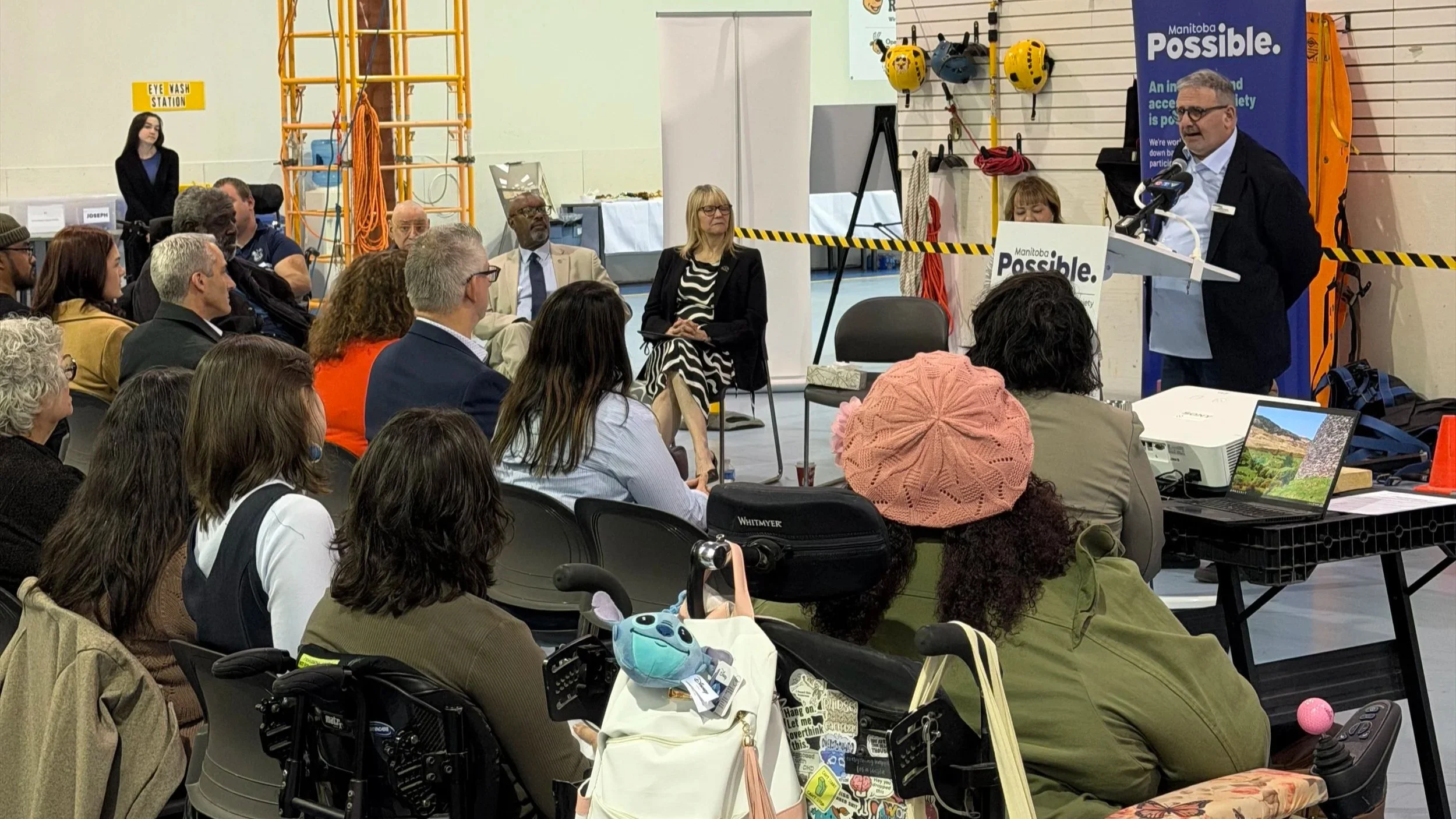 Manitoba Possible's Breaking Barriers Campaign Launch. Campaign Chair Gavin Rich is speaking at podium in front of audience.