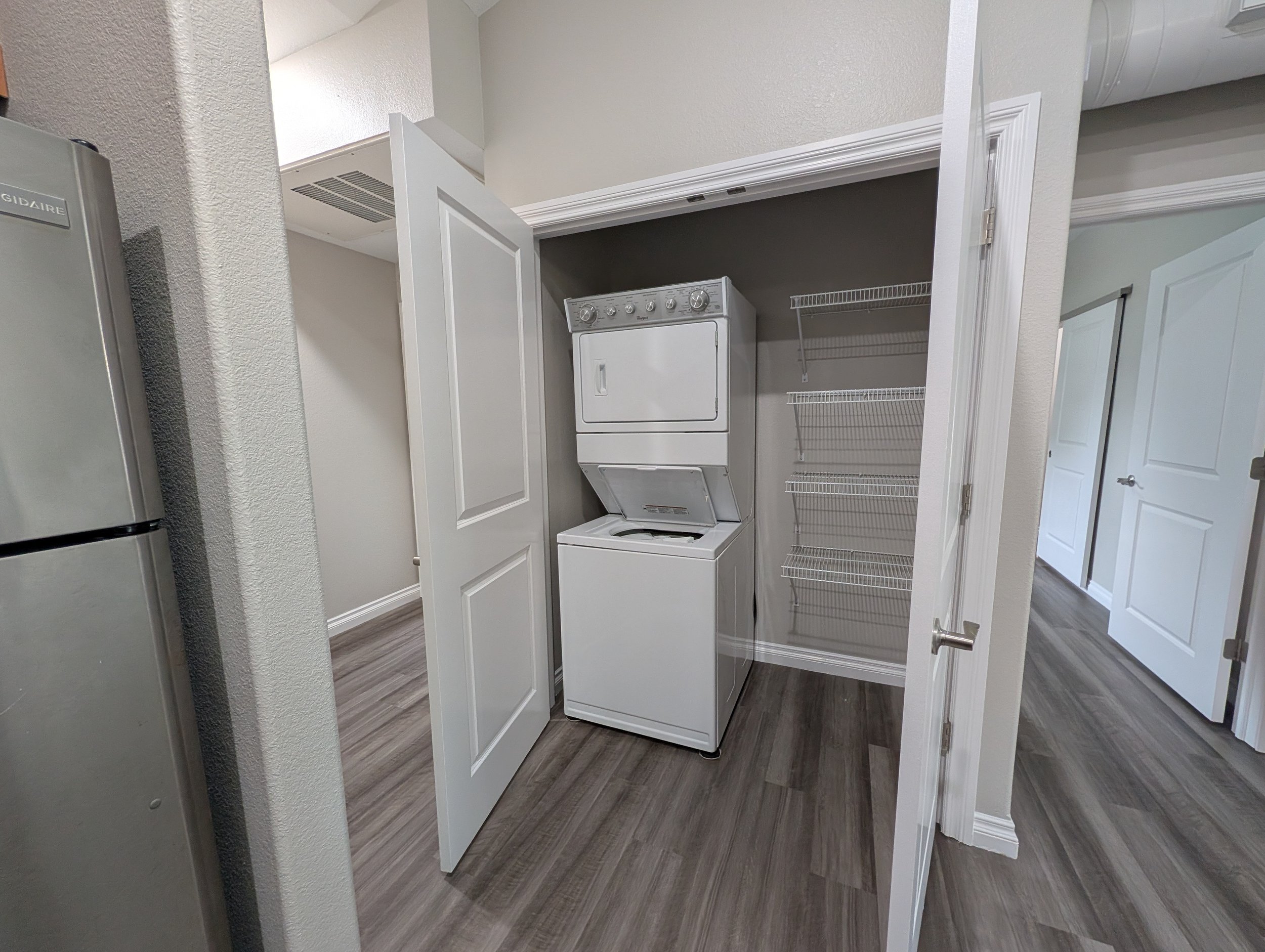 Stacked laundry machines in each unit.