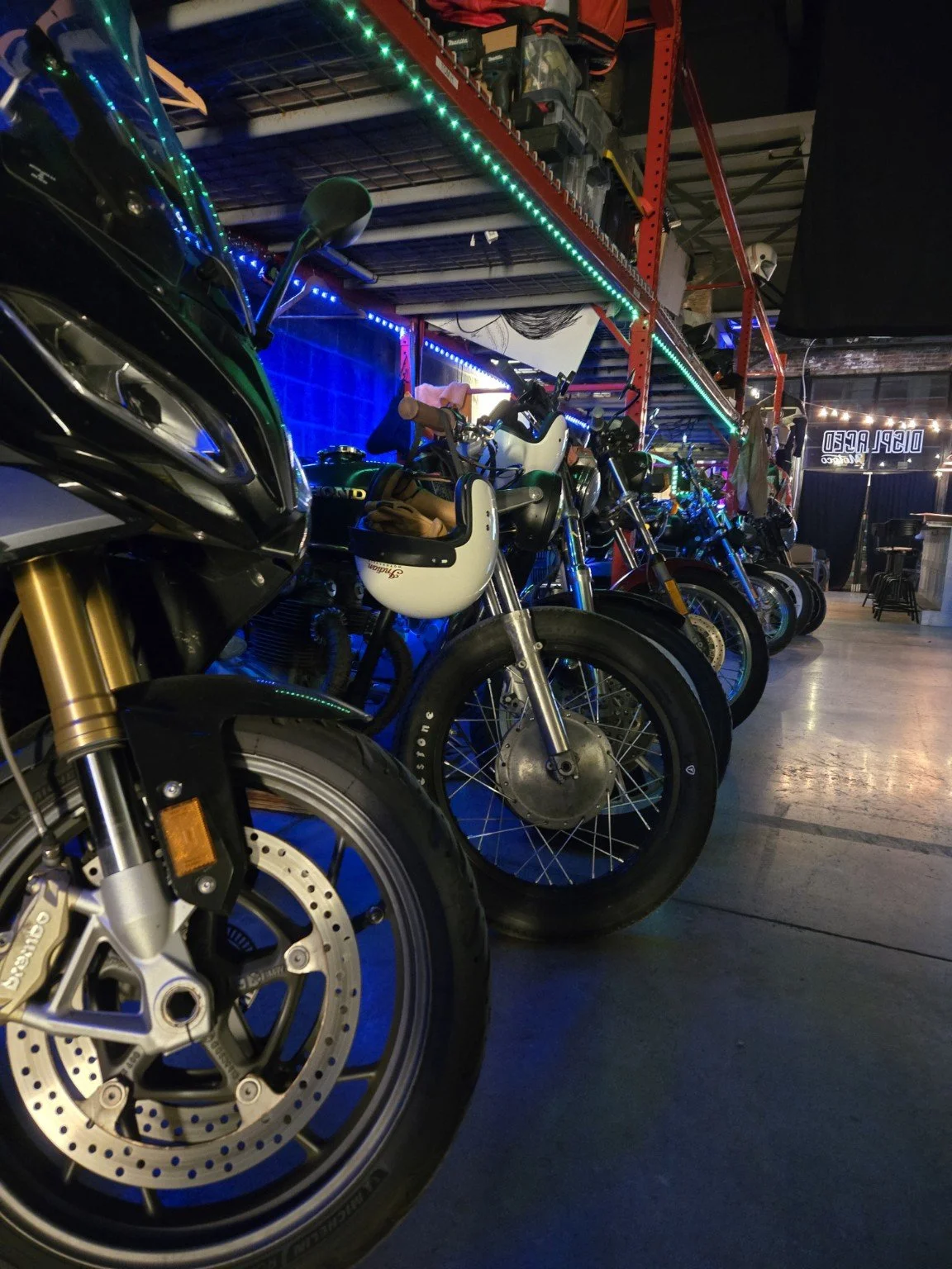 Motorcycles stored inside Displaced Motoco at 173 Coffey Street.