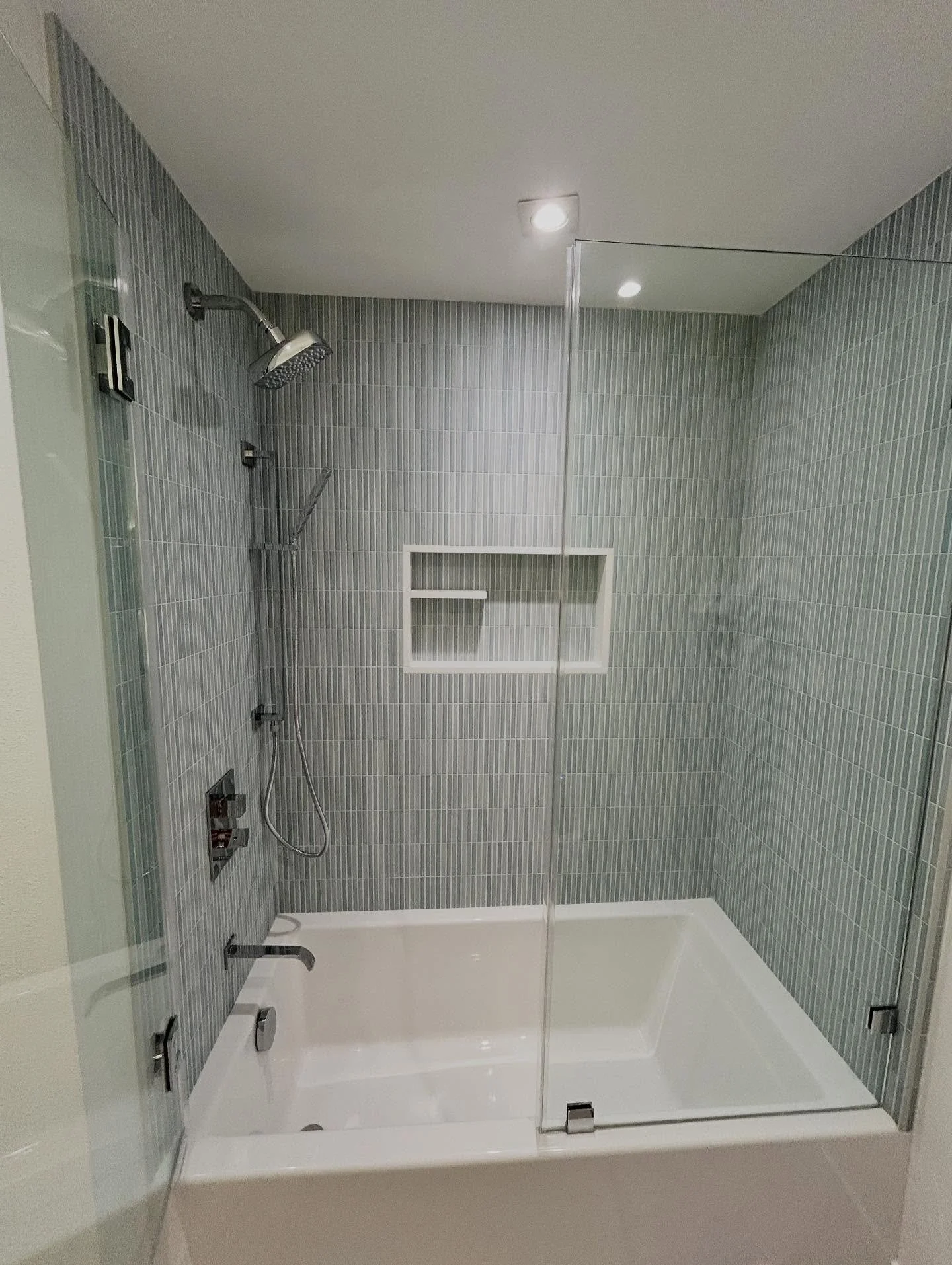 Fresh bathroom renovation with a beautiful twist - a custom ledge for flowers in the shower! Our fabulous client is a florist! 🌸 #bathroomremodel