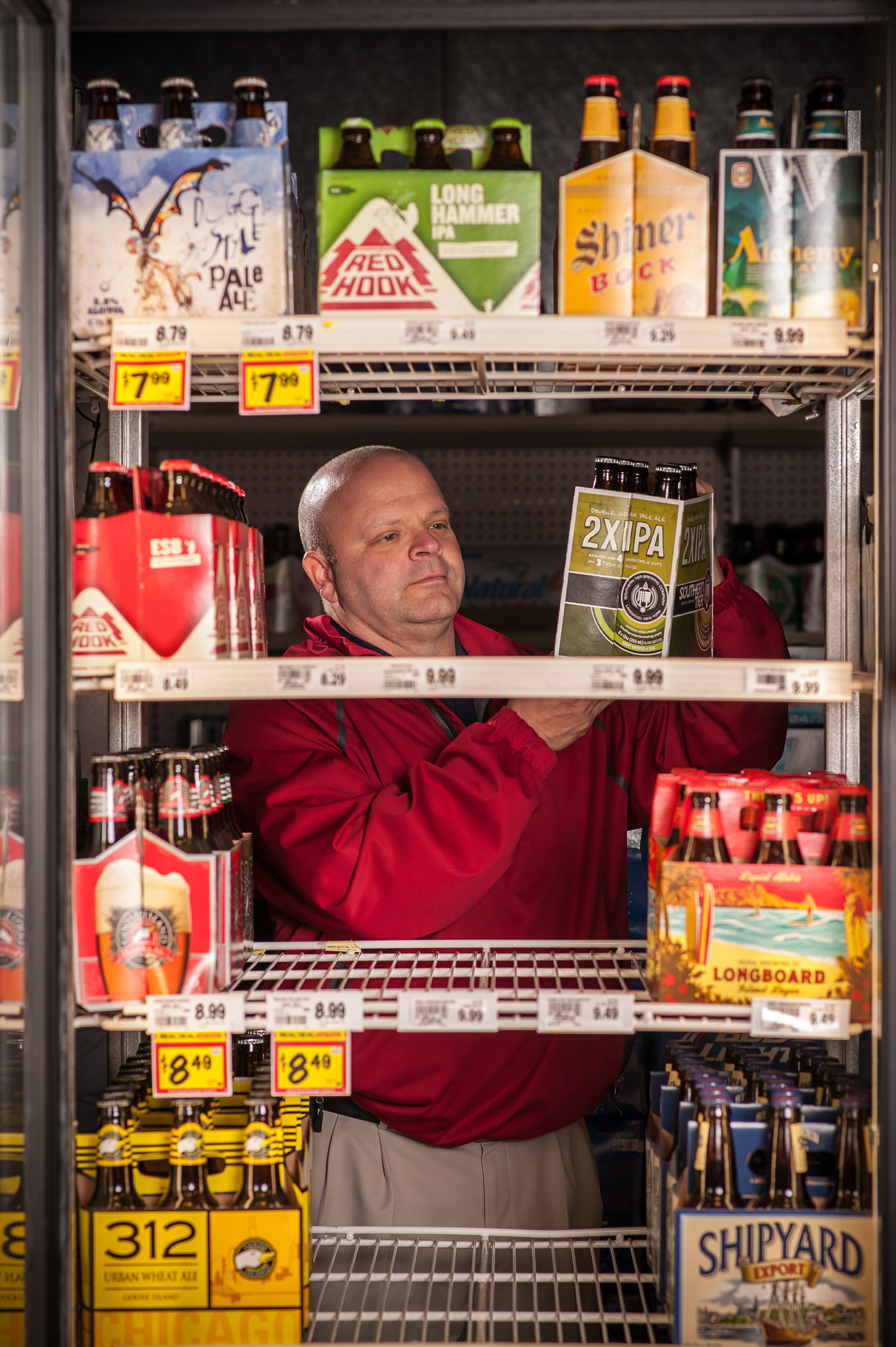 trieagle guy stocking craft shelves.jpg