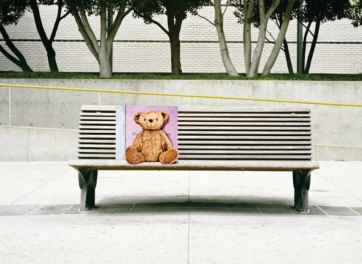 we placed real teddy bears around town on mall & bus benches with a comforting message behind them