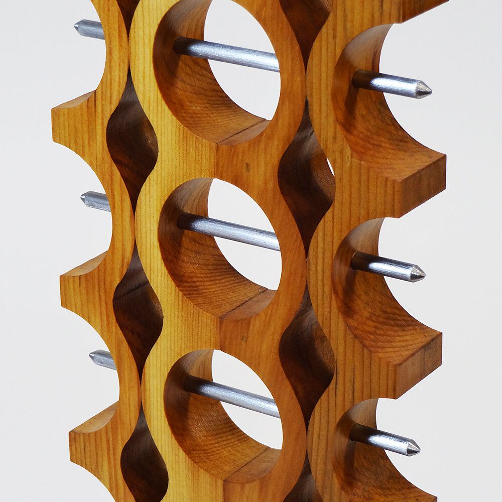 Modern Table Sculpture with Totem Design Showcases Piercing Steel Rods