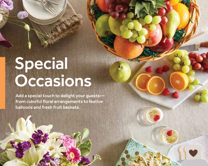 A table setting with a colorful fruit basket, fresh fruit slices, flowers, and decorative items for special occasions. A page from Sop n Shop's catering brochure.