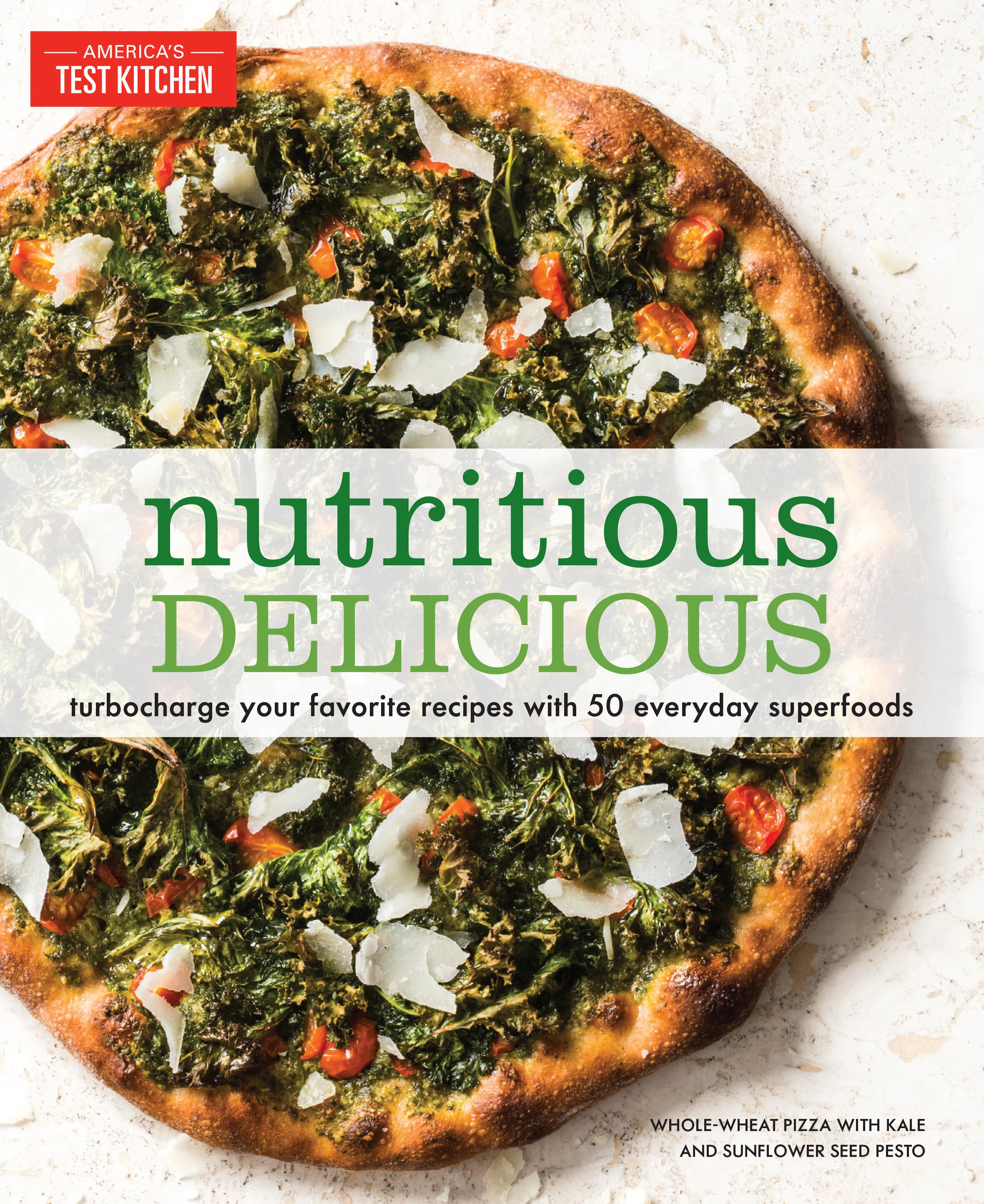 Cover of the cookbook, Nutritious Delicious by Americas Test Kitchen.  Whole wheat pizza topped with kale, sunflowers seed pesto, cherry tomatoes, and grated cheese.