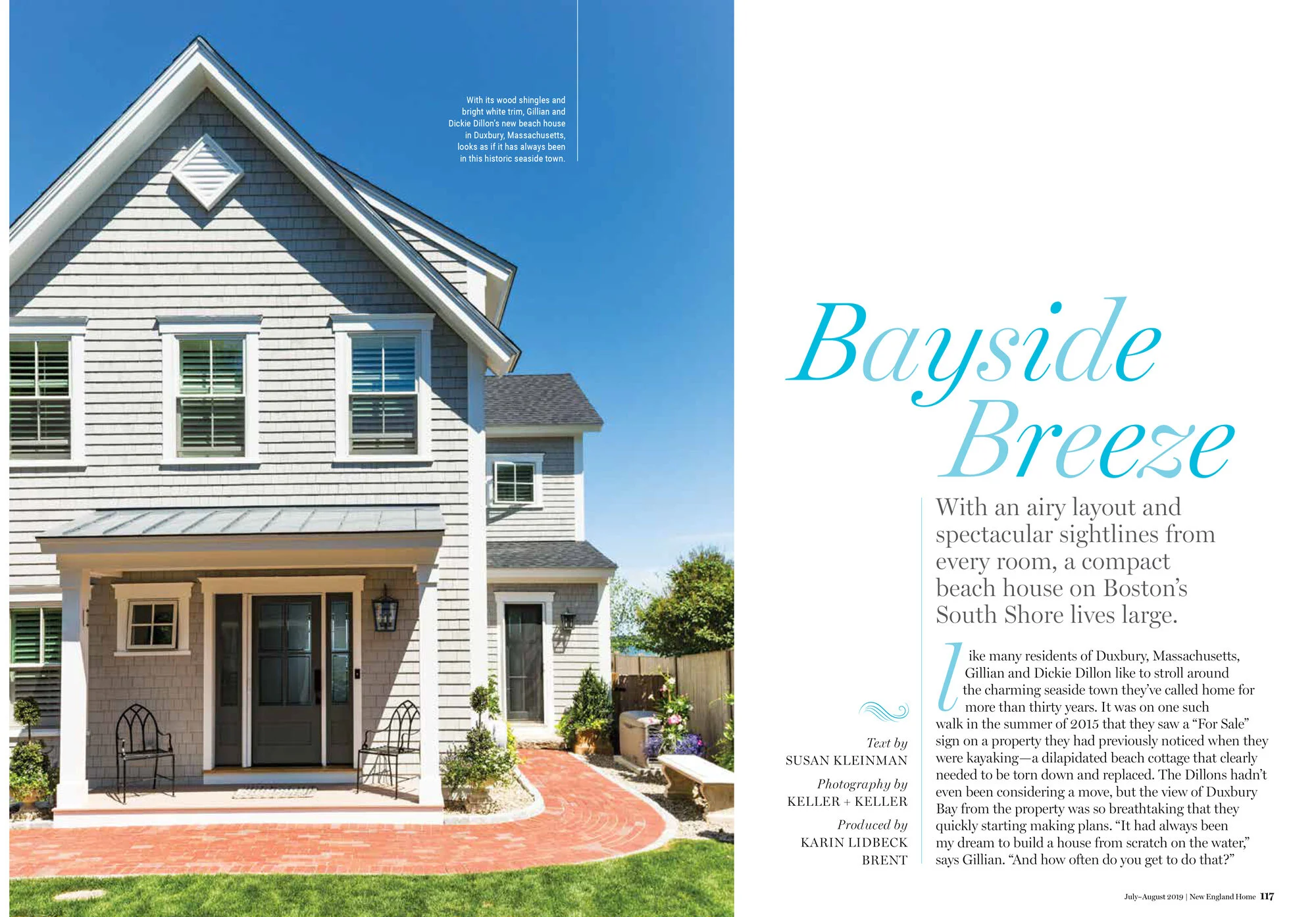 Page from magazine featuring a photograph of a white, coastal-style house with wood shingles, a covered porch, and windows with white trim, set against a blue sky and landscaped yard. The right side contains an article titled 'Bayside Breeze' with te