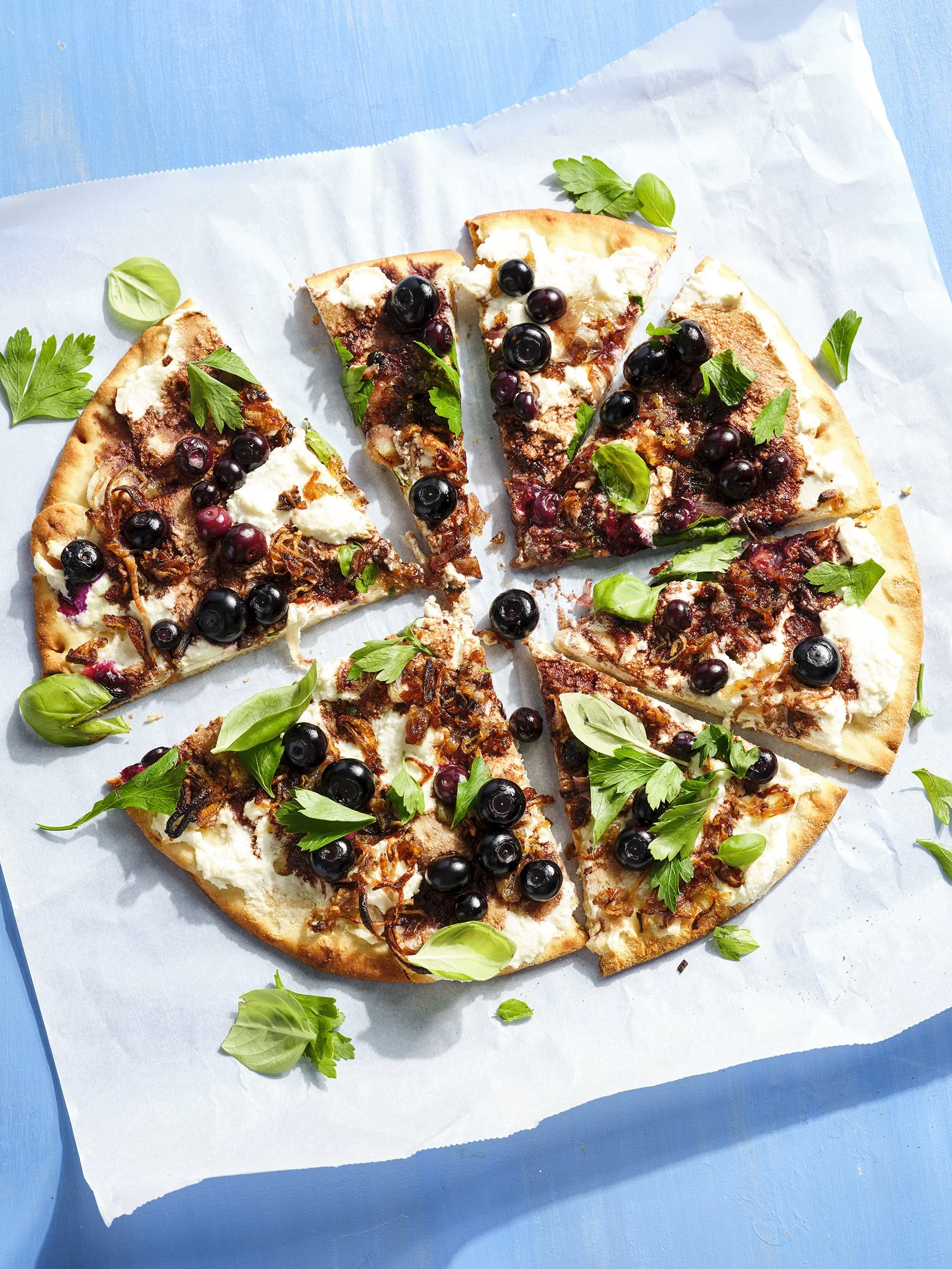 Blueberry and basil pizza. Photographed for the cookbook: Blueberry Love.  Boston based food and hospitality photographer.