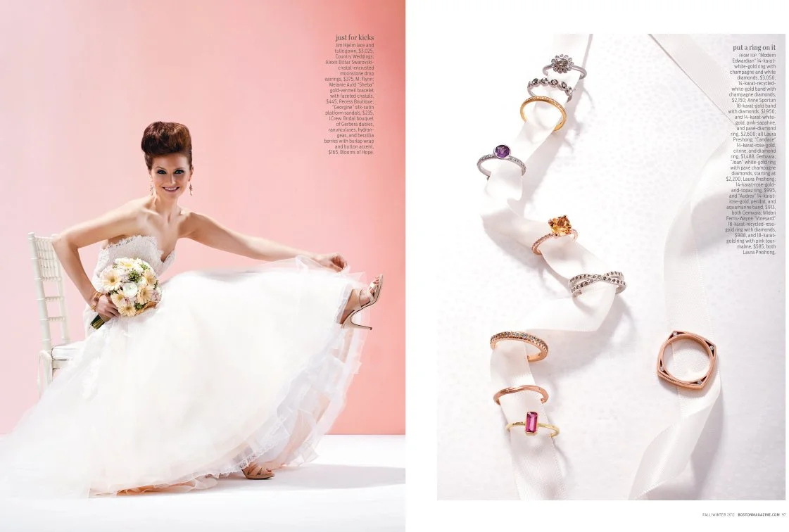 A woman in a white wedding dress sitting on a white chair, holding a bouquet, with pink background on the left. On the right, a display of rings on a white ribbon.