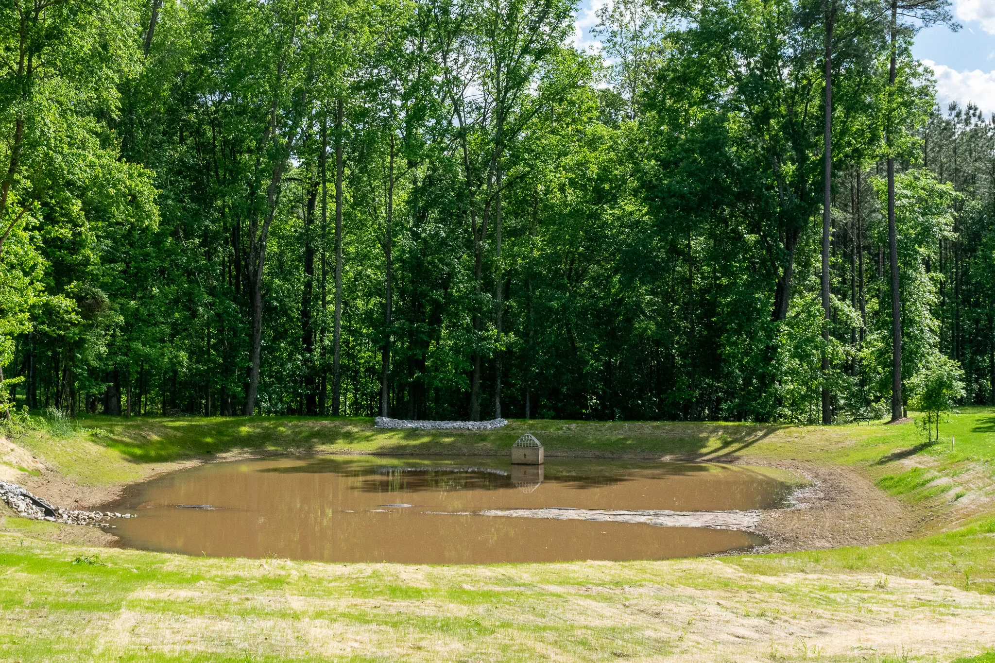 The sediment catch basin has been converted to a stormwater control measure, stormwater pond.