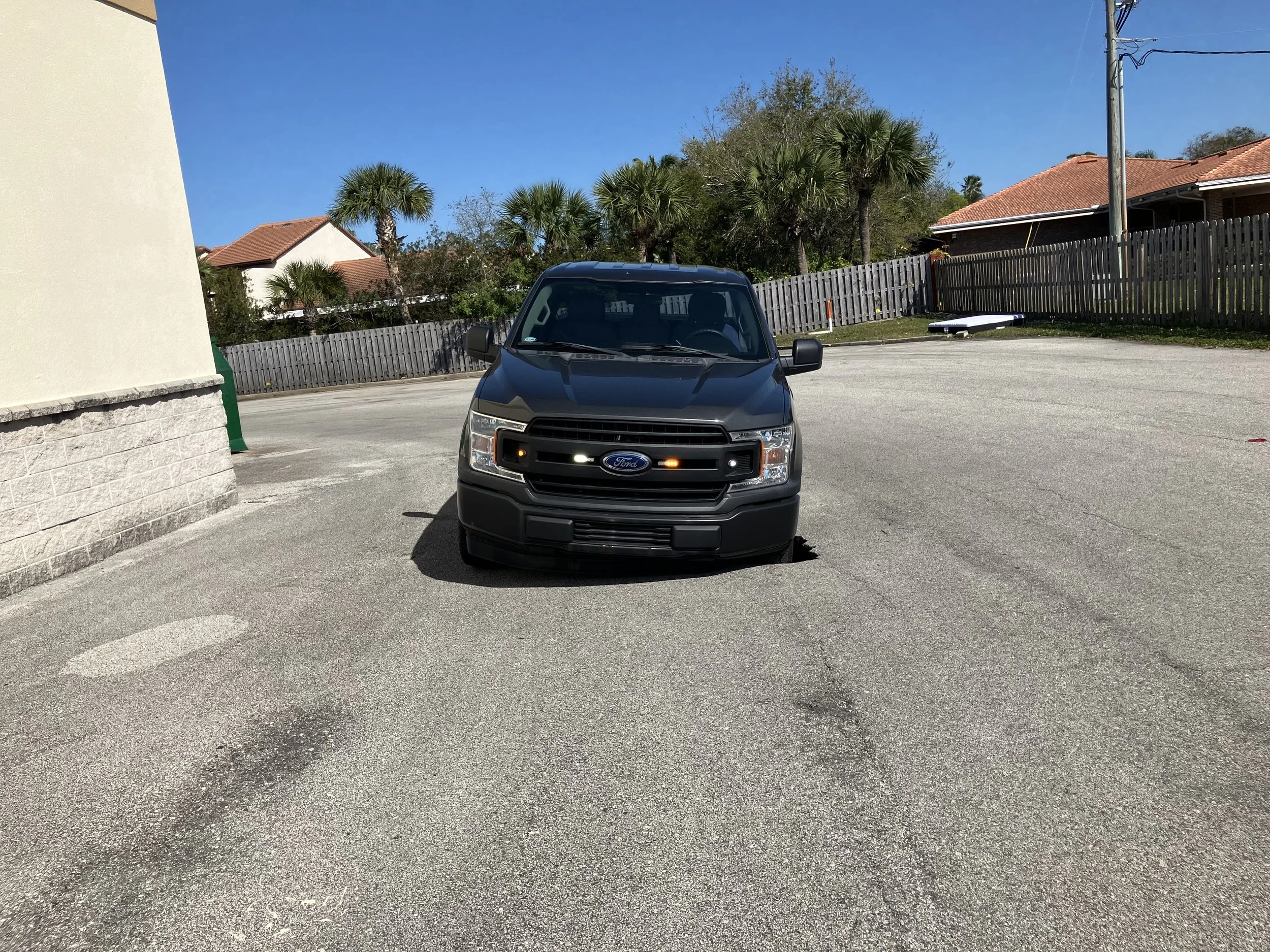 This truck has driven into a small parking lot sinkhole caused by a stormwater pipe separation under the surface. The sinkhole will worsen and become more dangerous until properly addressed.