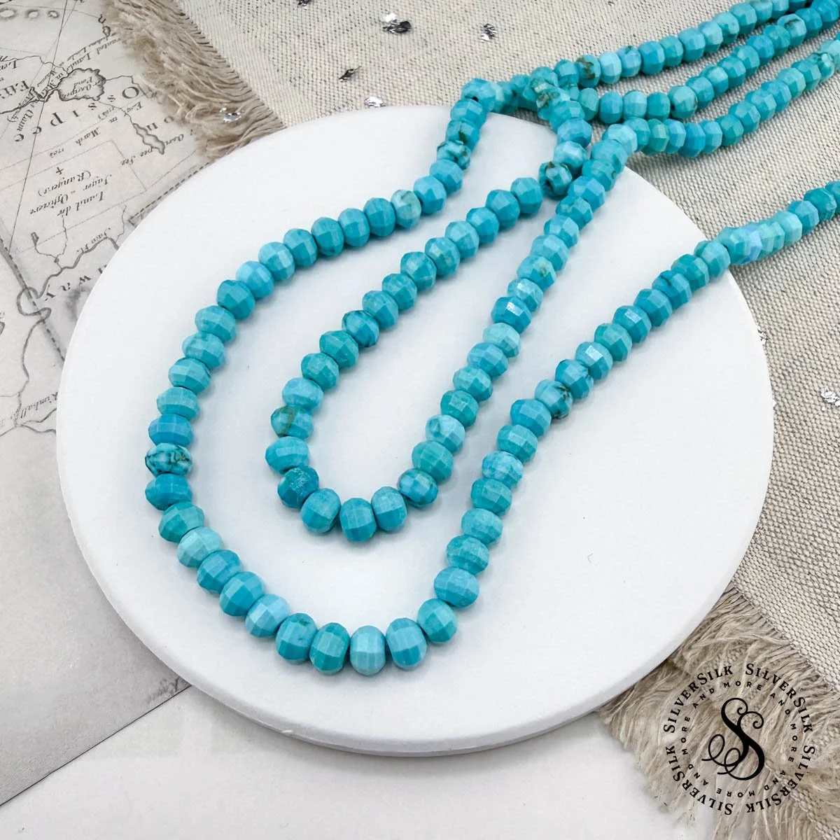 4x6mm Faceted Light Blue Howlite Lantern-shape Gemstone Beads - 7.5in Strand