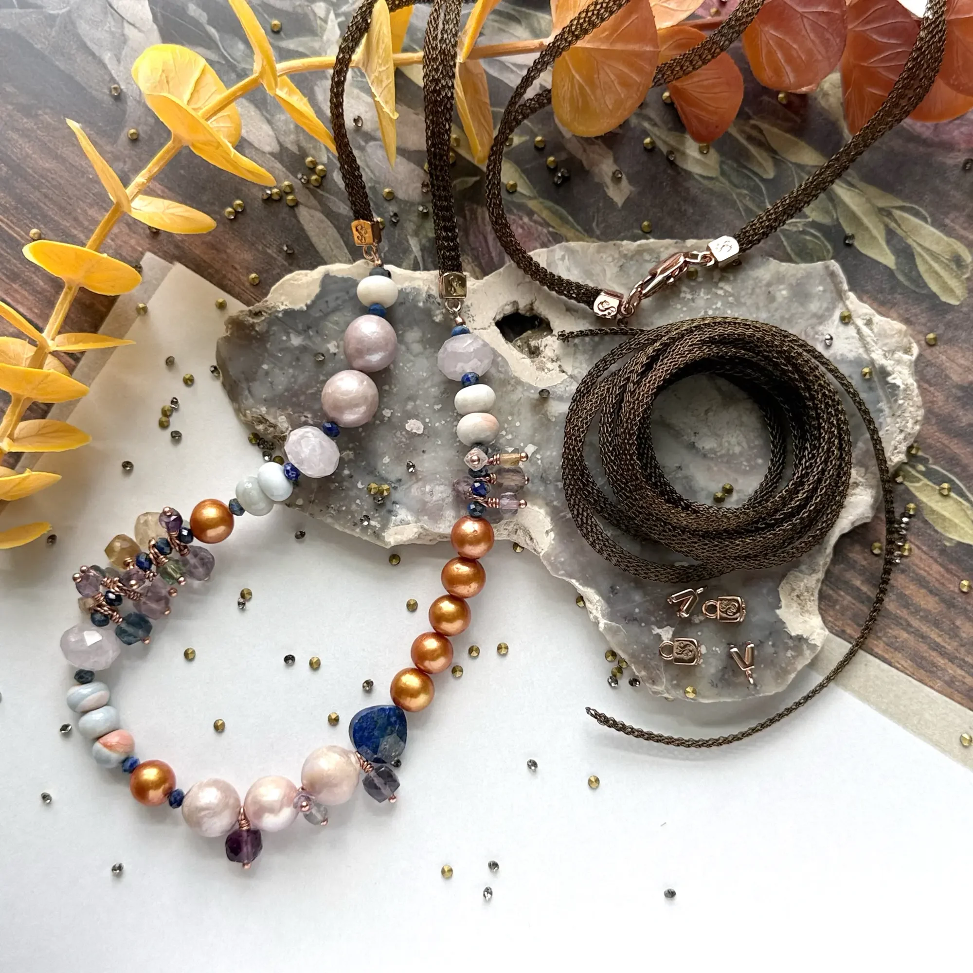 Bronze SilverSilk mesh cord necklace with gemstone and pearl pendant, displayed alongside a mixed pearl and gemstone beaded bracelet.