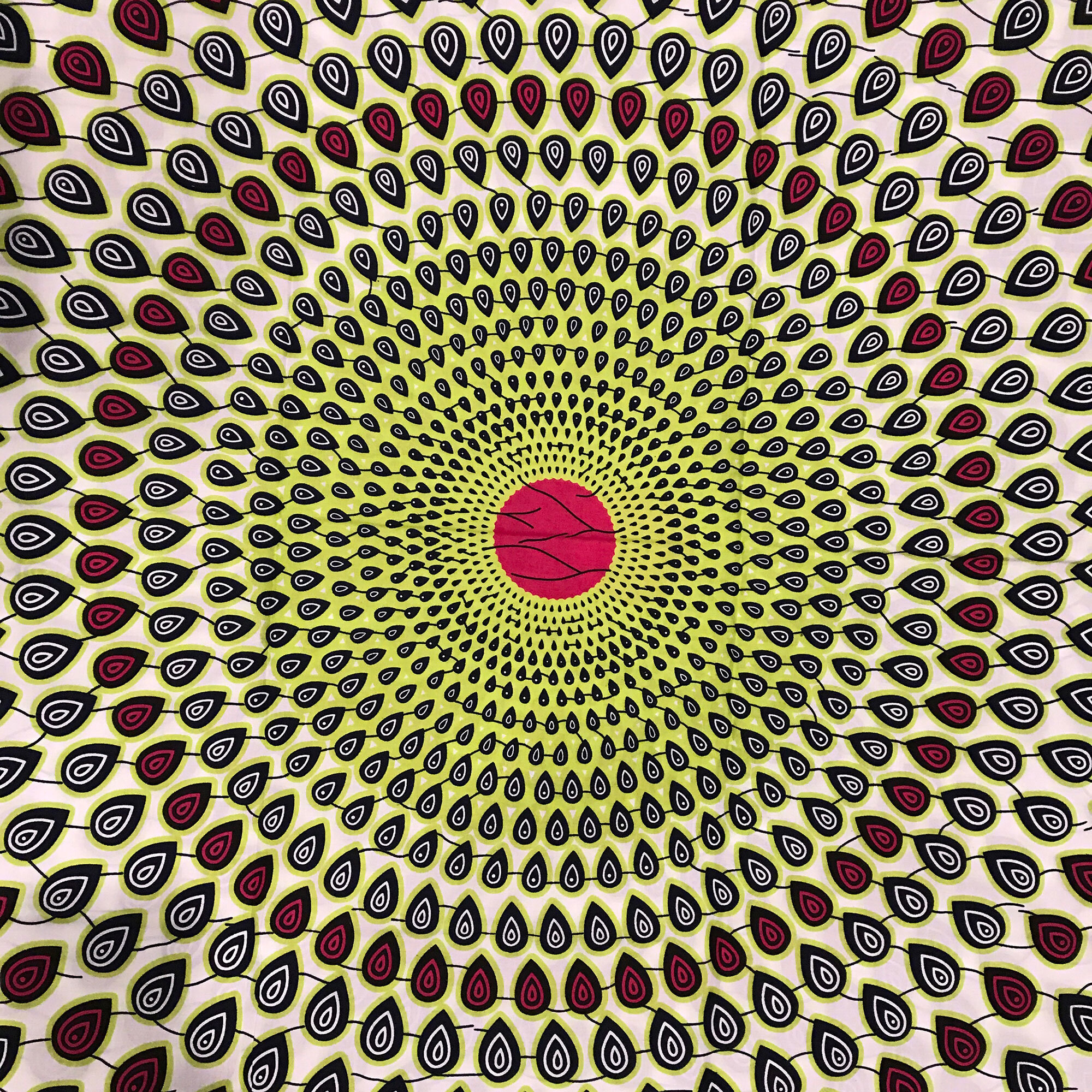  Pink, green, red, black, and tan radial teardrop pattern 