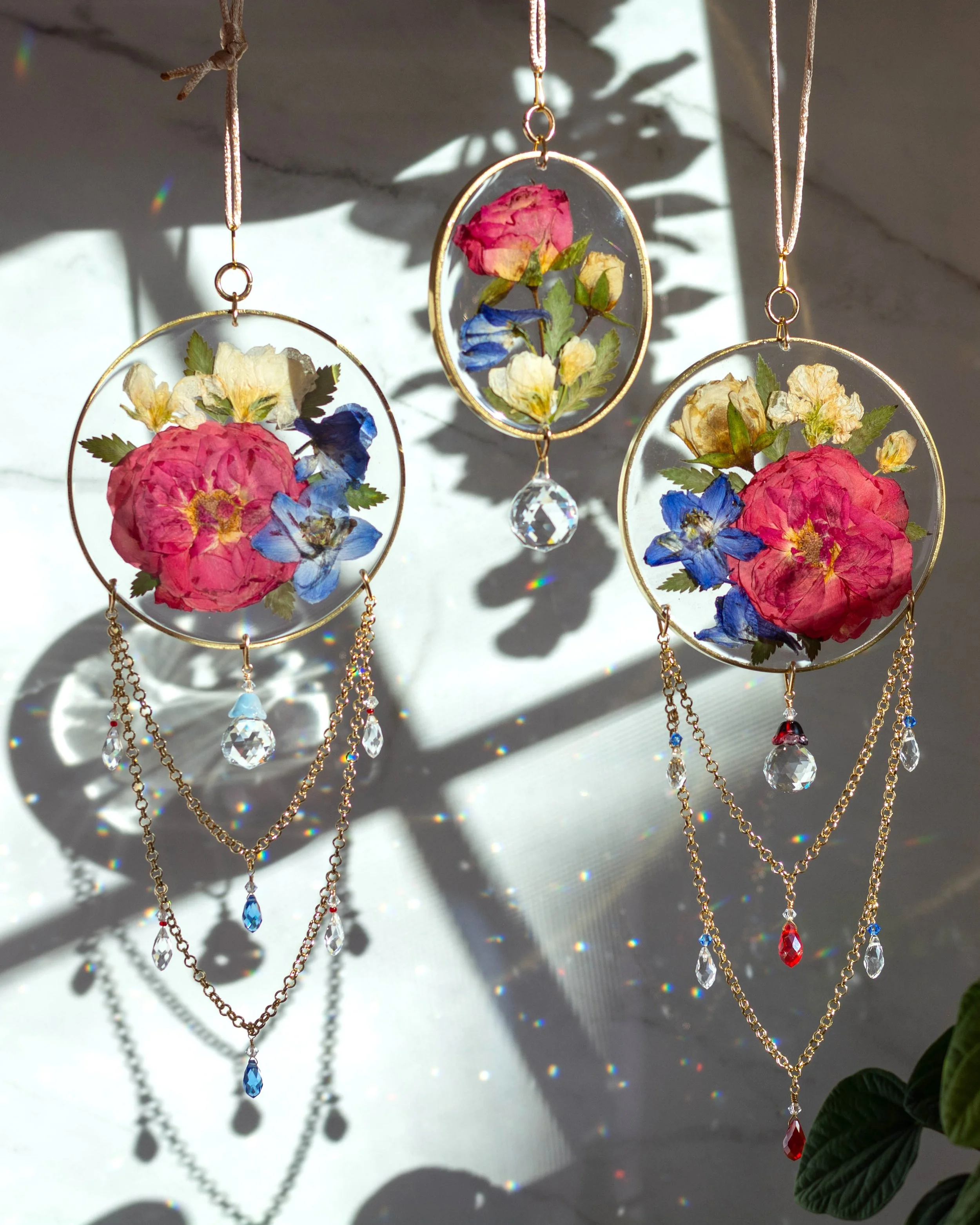 4" round and 3" oval brass sun catchers with resin, beaded