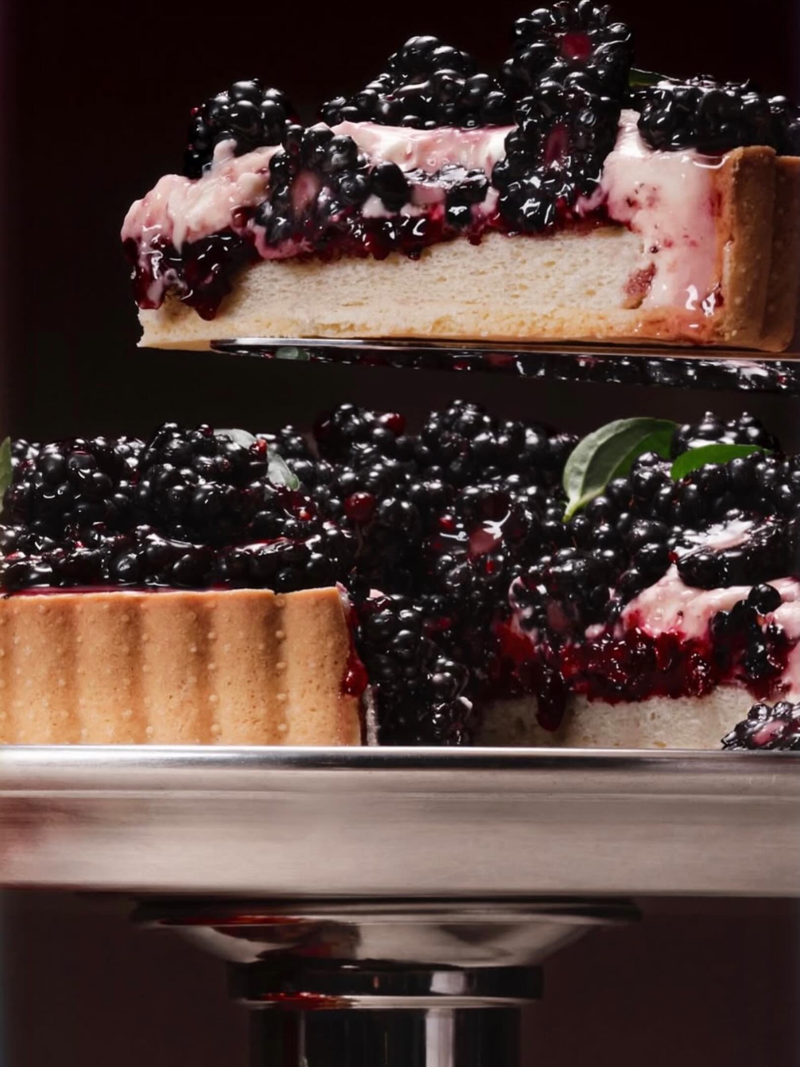 More deliciousness from our shoot @lamerceriepatisserie @rwguild . One of our last shots of the night with @hisuzanne on the last day of our shoot . I love this luscious blackberry tart and the silver Pillar I used to add a little heft and height und