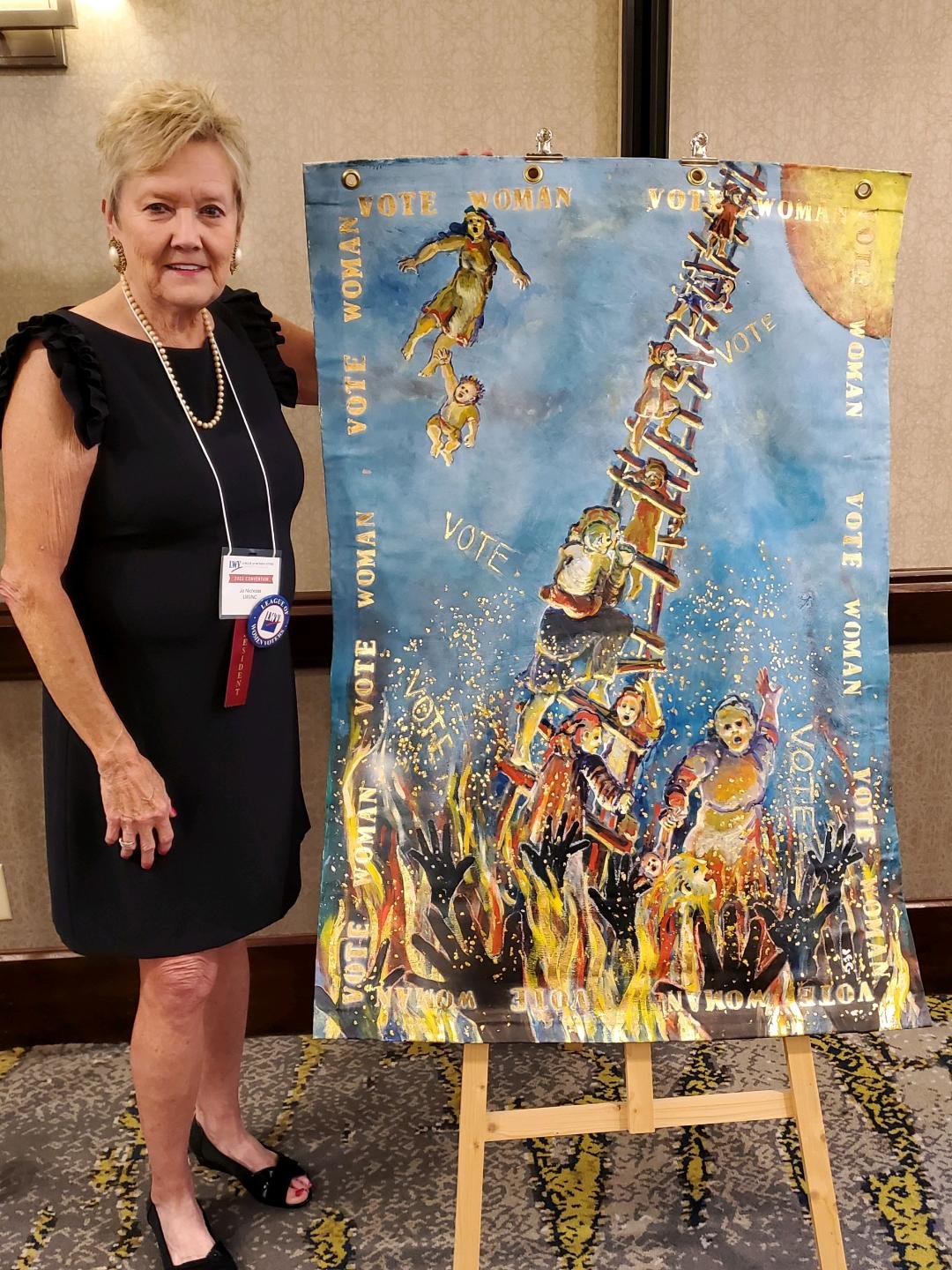 Jo Nichols (Outgoing LWVNC President) with Joanie Gardner_s artwork.jpg