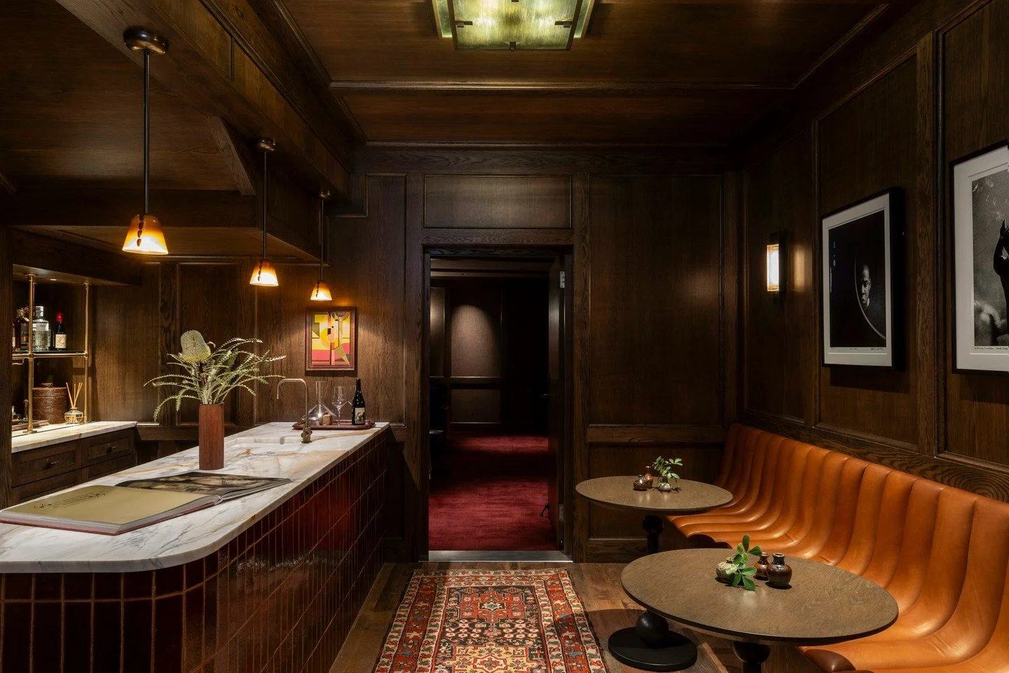 We act as design detectives to translate how a client wants to feel into a physical environment. For this project, that meant evolving an underutilized hall and closet into a sophisticated speakeasy and a high-performance home theater.

Builder: Tofk
