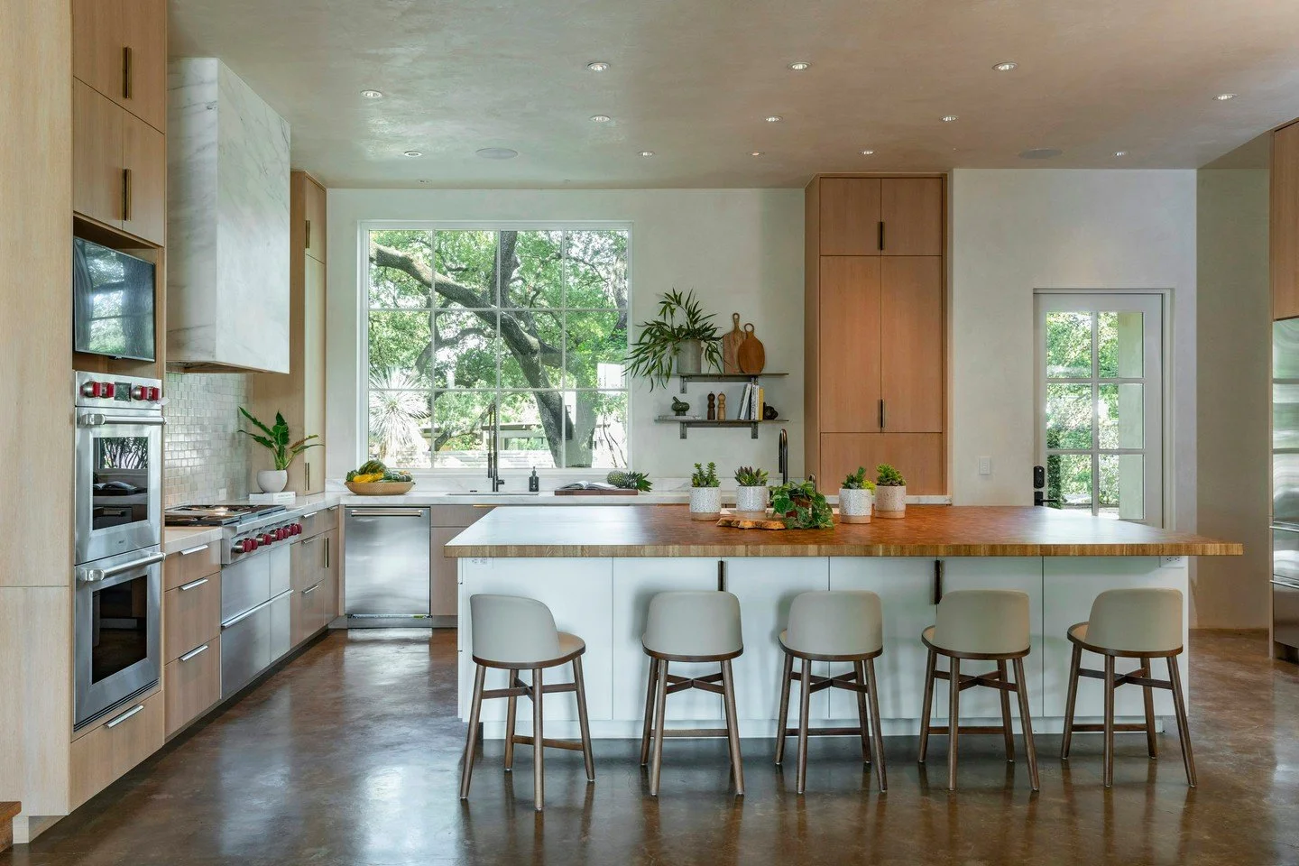 We designed the kitchen around the oak outside the window as much as the one on the island. Nature dictated the palette, and we simply followed its lead.

Builder: Tofka Construction LLC
Landscape Architecture: @campbelllandscapearchitecture
New Buil
