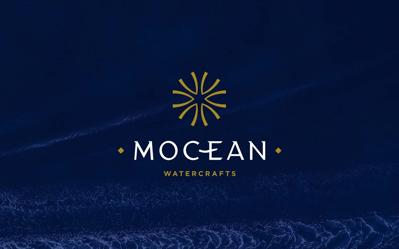 Mocean Watercrafts logo on ocean background