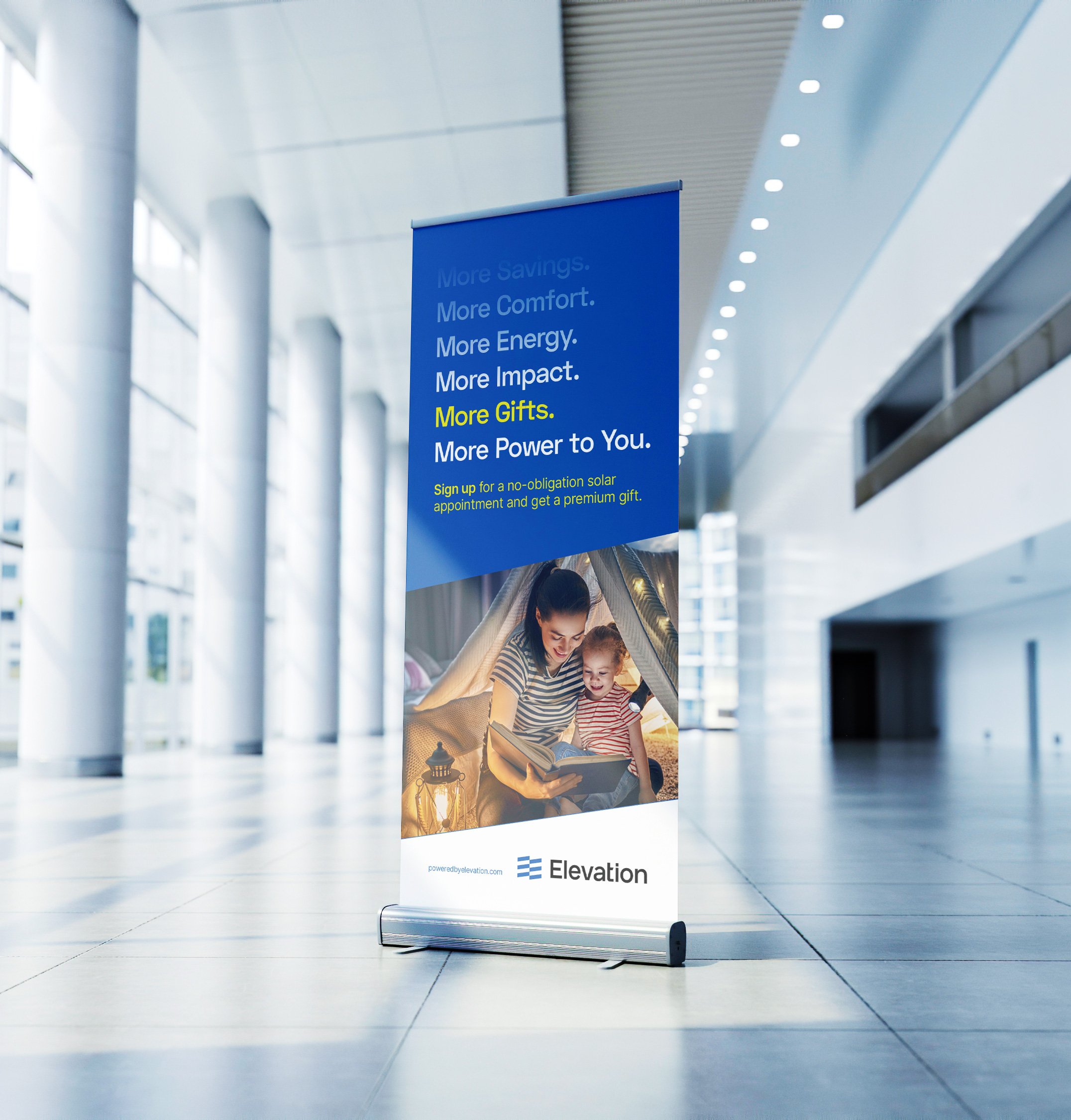 Roll-up banner promoting solar energy by Elevation, featuring text about savings, comfort, and gifts, with an image of a woman and child reading in a blanket fort, placed in a modern, spacious hallway.