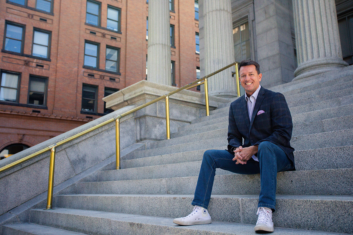 Tom sitting on steps.png