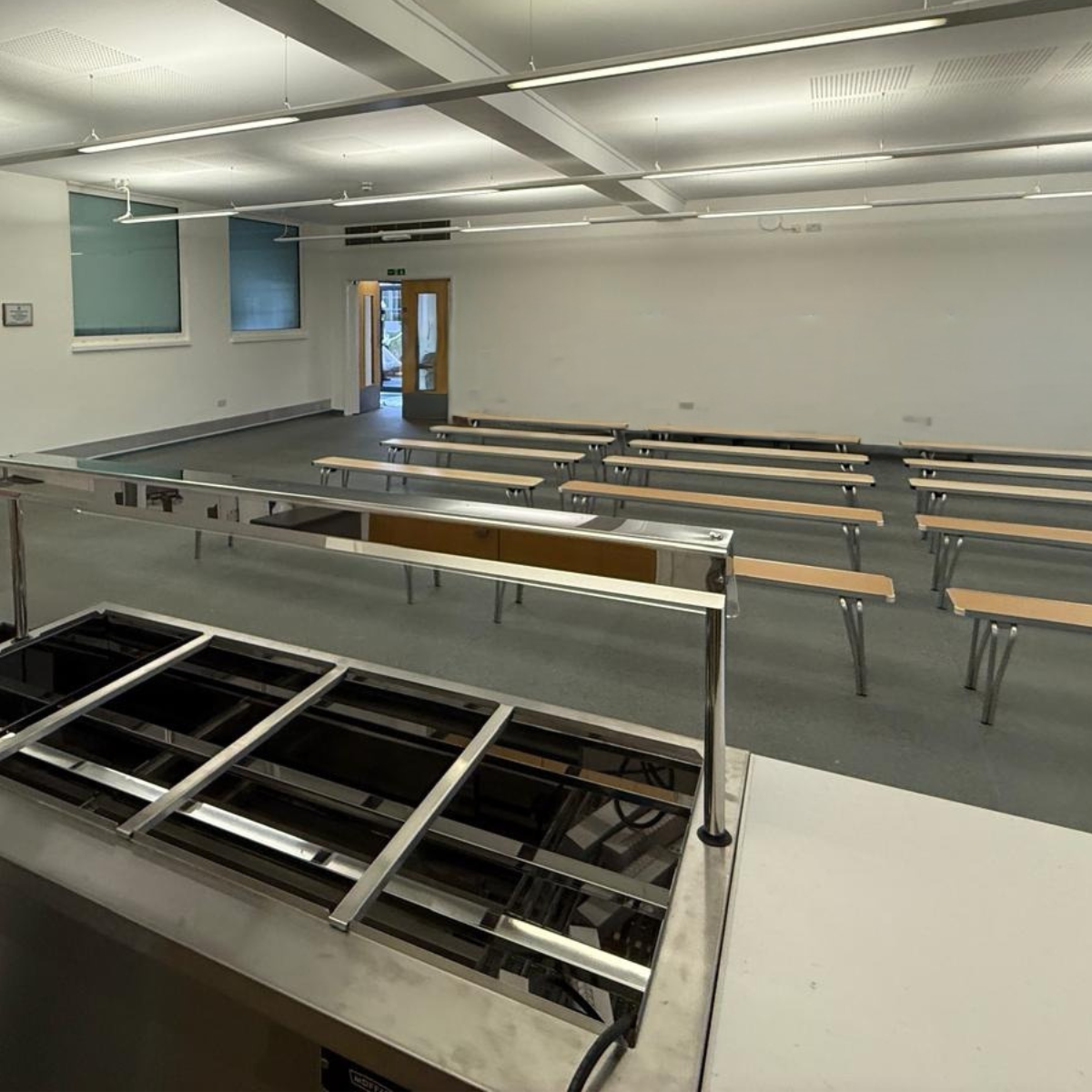 The school canteen, with wooden benches.