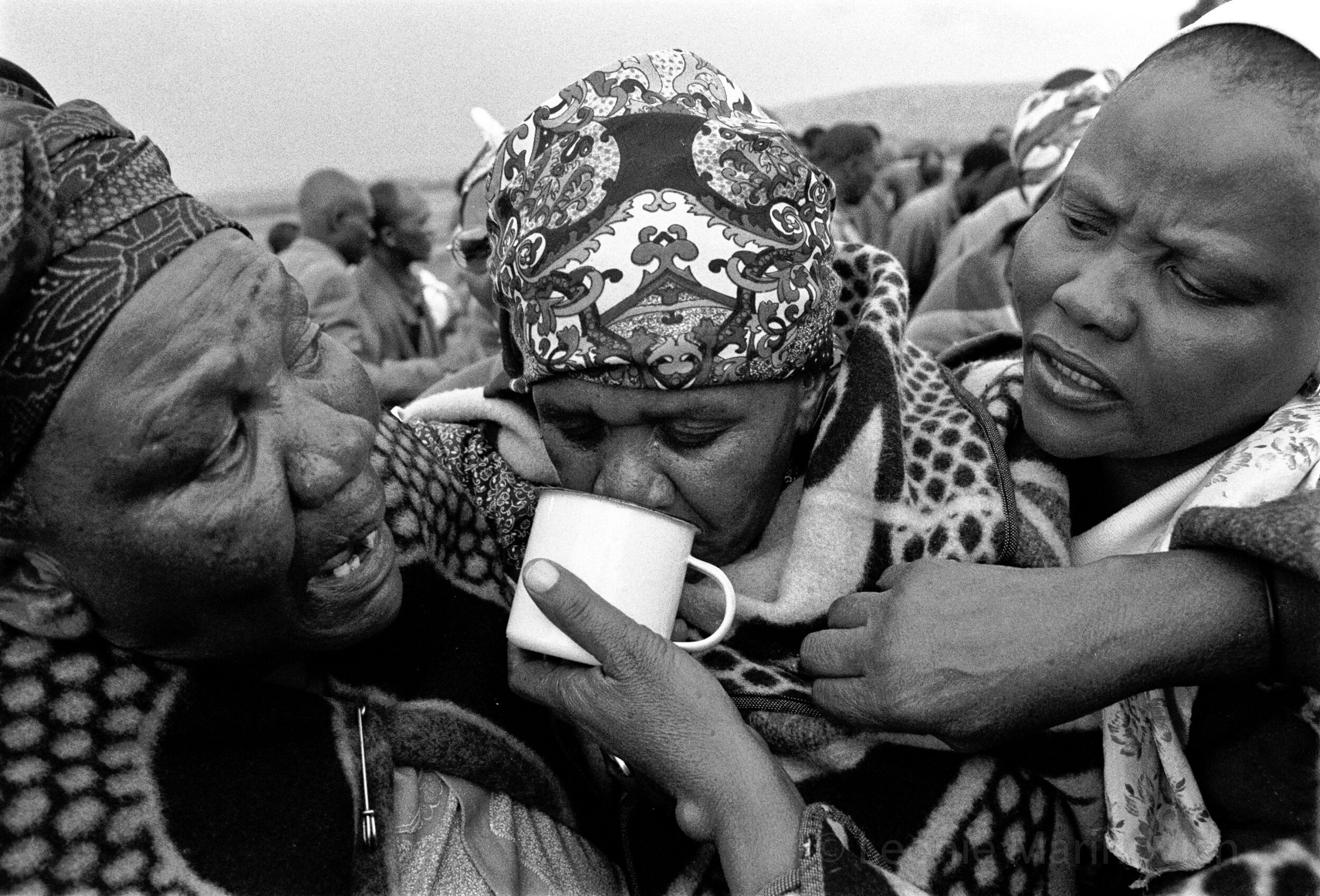 Community members and family from the farms and nearby Ficksburg town in the eastern Free State attend the wake and funeral of a young woman who succumbed to Aids 2002. Photo Leonie Marinovich