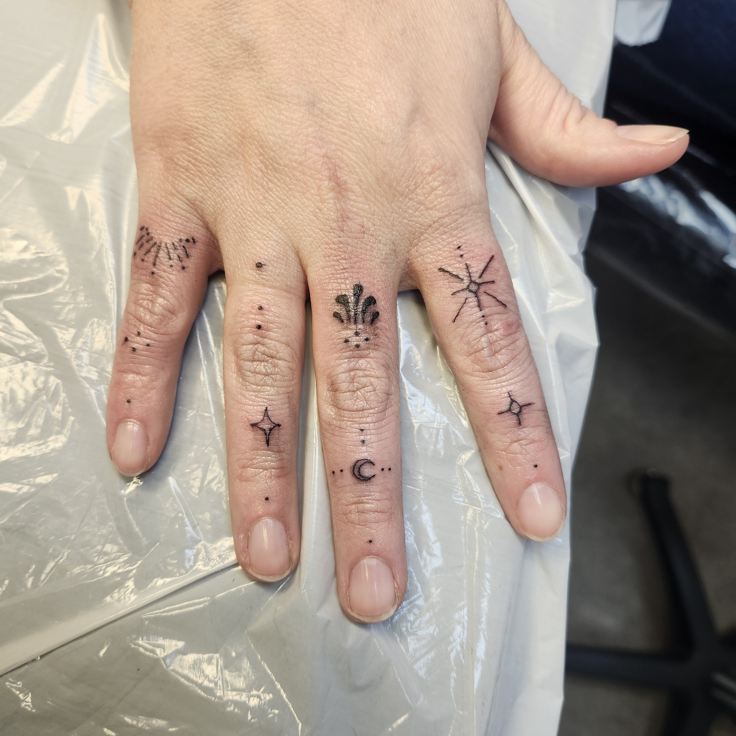 AT Amanda fingers tattoo.jpg