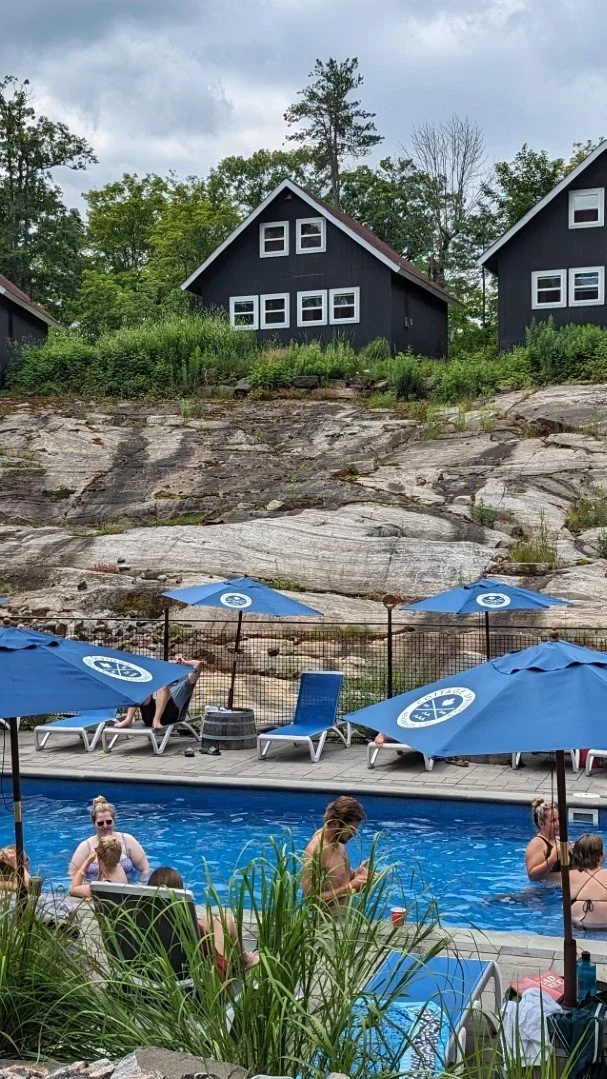 a group of people enjoying the pool at Muskoka BeerSpa
