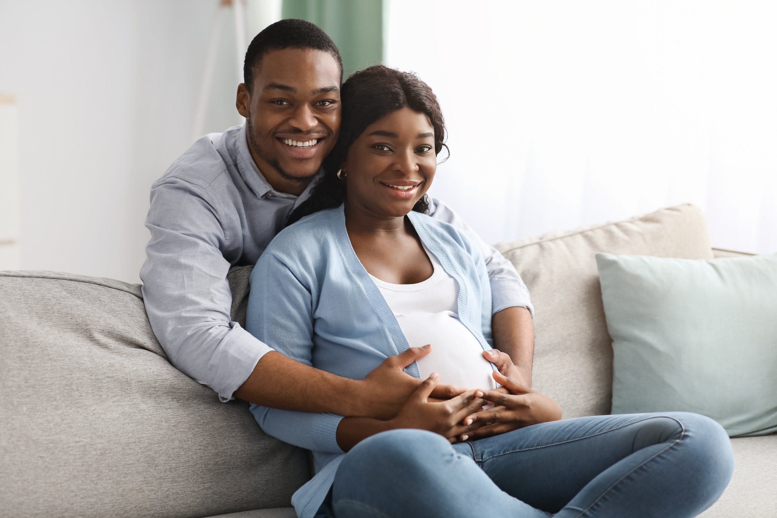 smiling-black-man-hugging-his-pregnant-woman-sitti-2021-09-02-05-07-43-utc.jpg