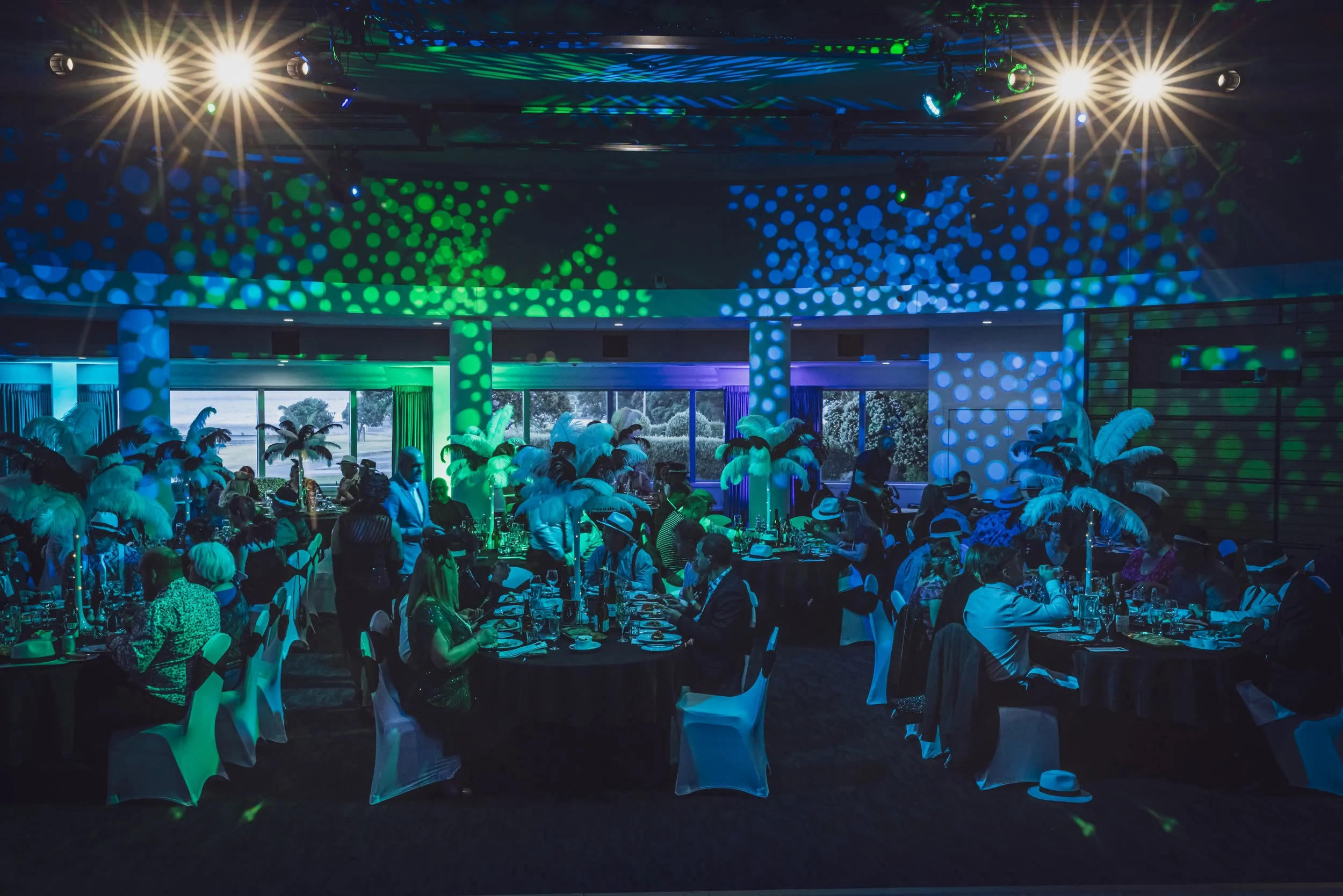 Attendees at the Mastercraft evening function at the Napier War Memorial Conference Centre - Blue and green lighting in the room