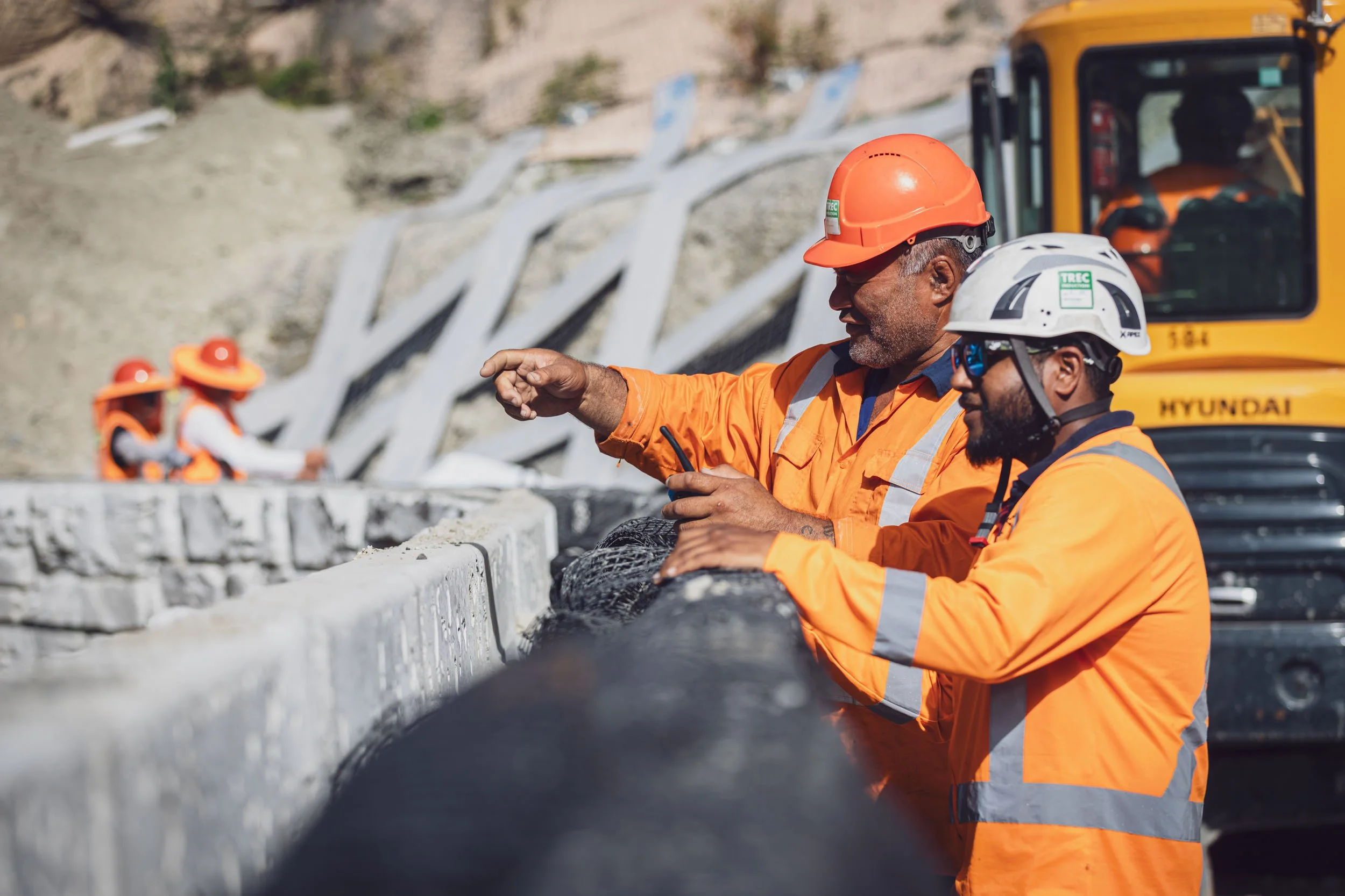 Two construction workers discussing the project at the Devil's Elbow site in Hawke's Bay